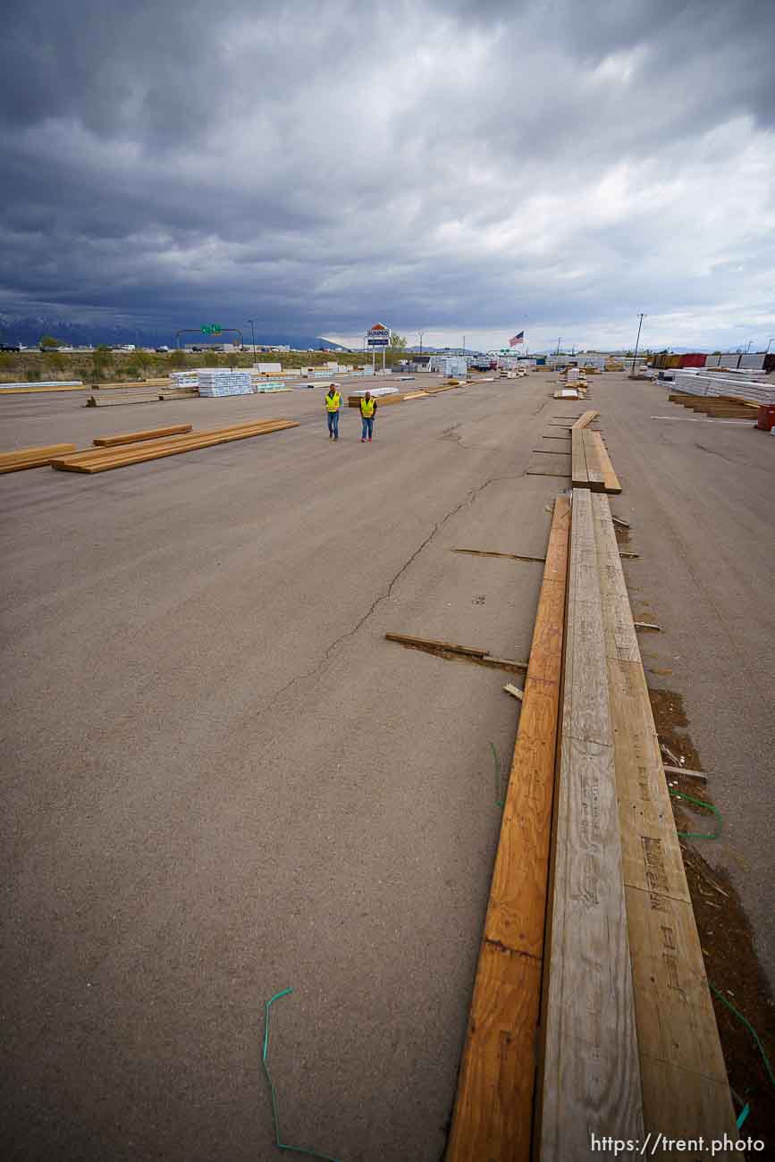 (Trent Nelson  |  The Salt Lake Tribune) Jason Butterfield and Jason Barnett walk through the sparse yard a Sunpro in Salt Lake City on Tuesday, April 27, 2021. A national shortage of lumber is stalling and driving up costs on big construction projects and small home improvements alike in Utah.