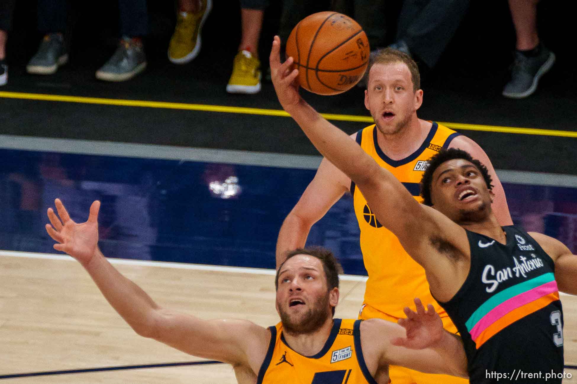 (Trent Nelson  |  The Salt Lake Tribune) San Antonio Spurs forward Keldon Johnson (3) grabs a rebound over Utah Jazz forward Bojan Bogdanovic (44) as the Utah Jazz host the San Antonio Spurs, NBA basketball in Salt Lake City on Monday, May 3, 2021. At rear is Utah Jazz guard Joe Ingles (2).