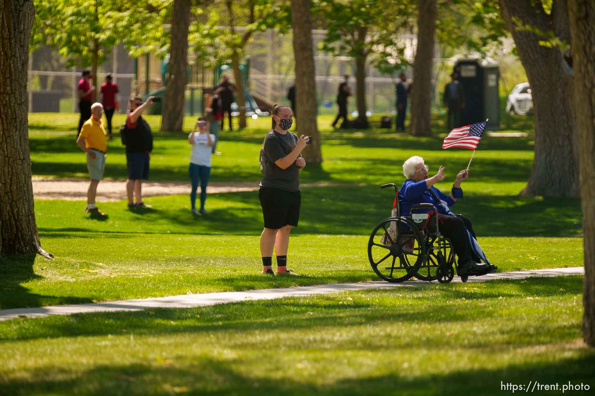 (Trent Nelson  |  The Salt Lake Tribune) A woman waves at first lady Jill Biden's motorcade in Jordan Park in Salt Lake City on Wednesday, May 5, 2021.