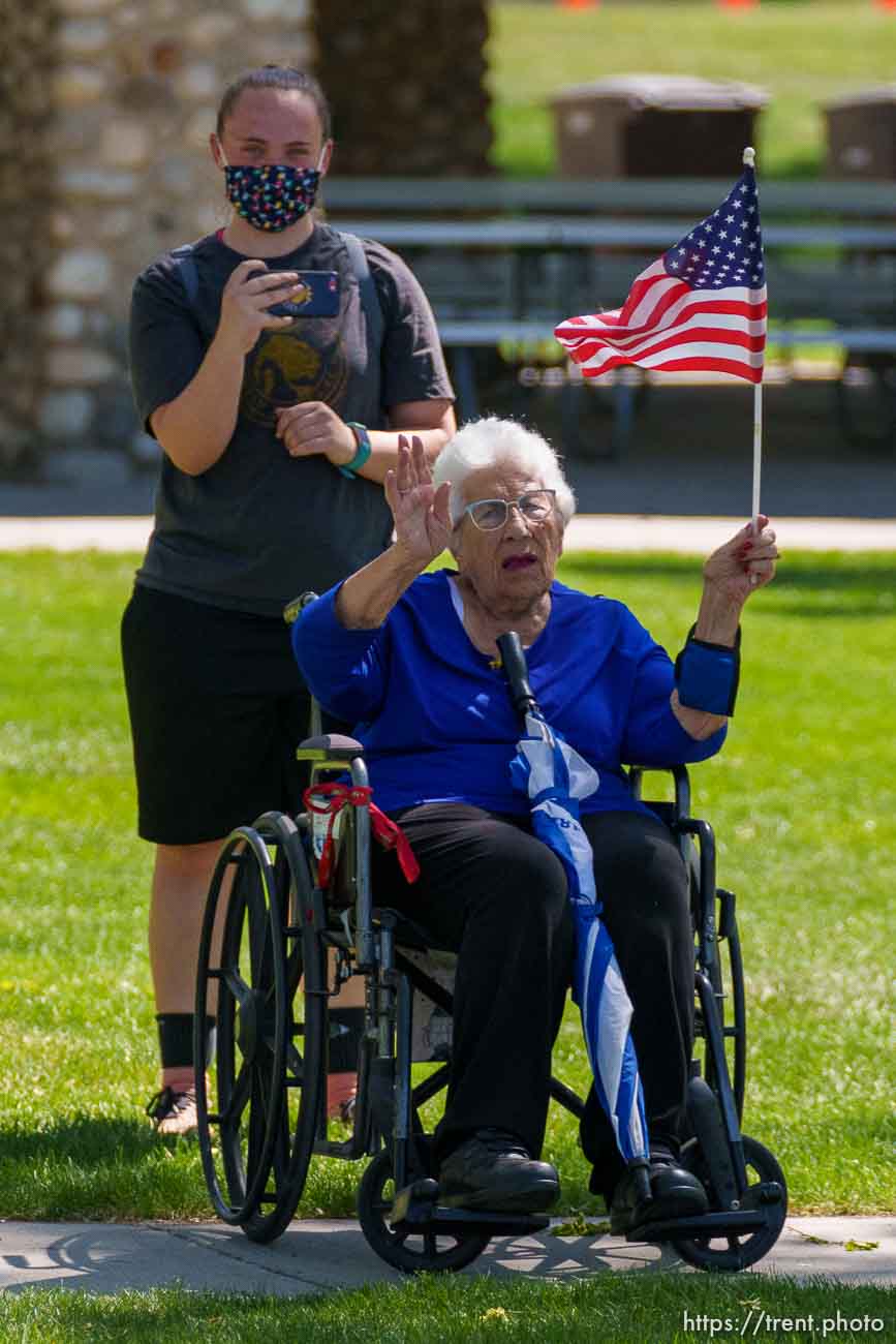 (Trent Nelson  |  The Salt Lake Tribune) A person waves at first lady Jill Biden's motorcade in Jordan Park in Salt Lake City on Wednesday, May 5, 2021.