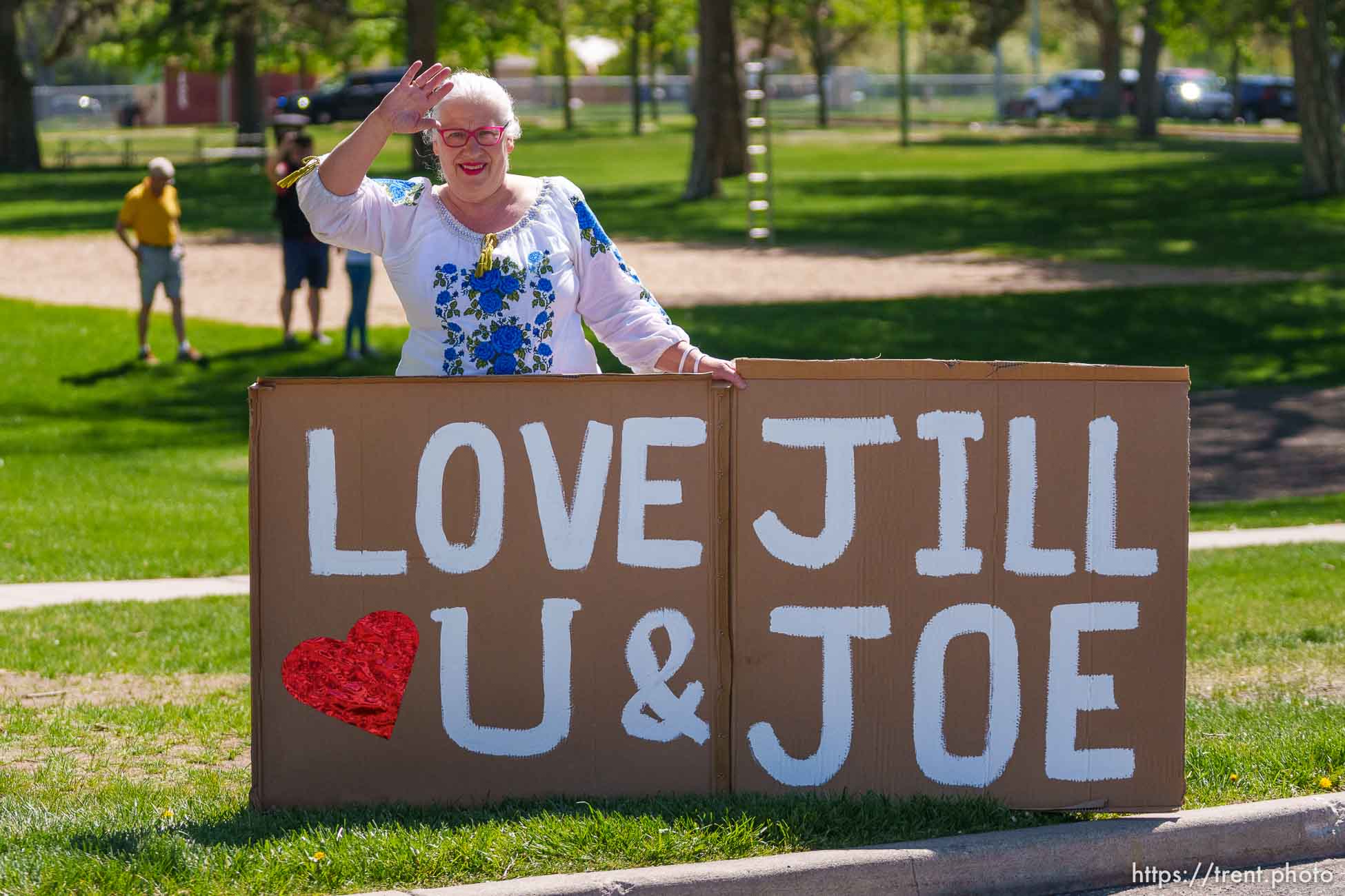 (Trent Nelson  |  The Salt Lake Tribune) A person waves at first lady Jill Biden's motorcade in Jordan Park in Salt Lake City on Wednesday, May 5, 2021.