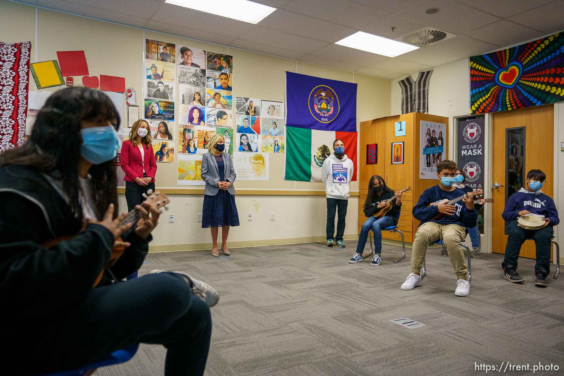 (Trent Nelson  |  The Salt Lake Tribune) Abby Cox and Jill Biden listen to a performance by the Ukelele Club at Glendale Middle School in Salt Lake City on Wednesday, May 5, 2021. Teacher Dane Hess is at right.