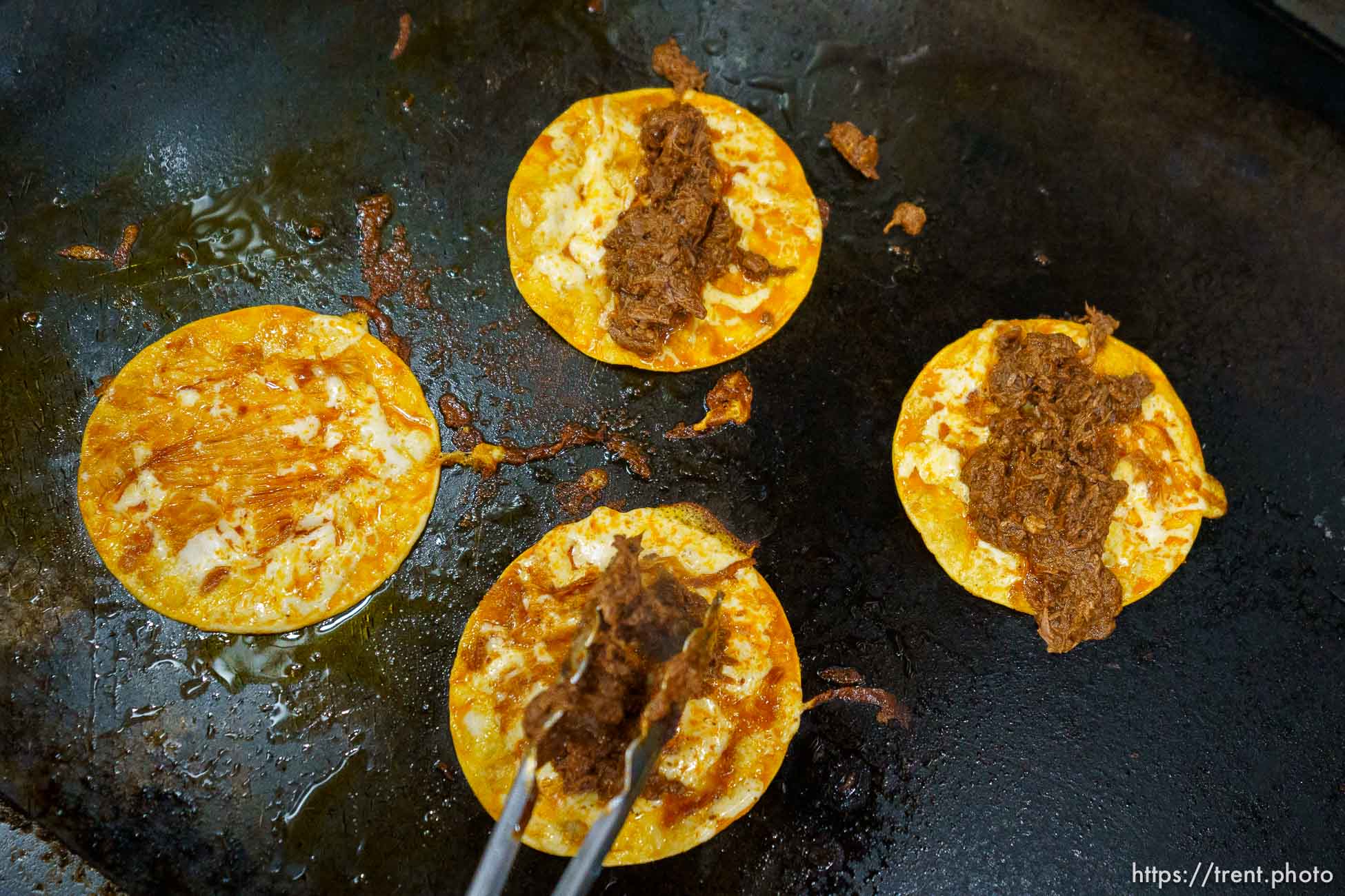 (Trent Nelson  |  The Salt Lake Tribune) Sergio Castillo cooks Birria Tacos at Santo Taco in Salt Lake City on Monday, May 10, 2021.