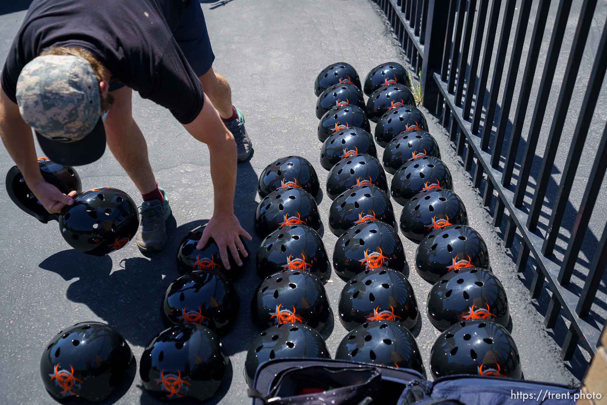 (Trent Nelson  |  The Salt Lake Tribune) Alex Schmidt lines up helmets as volunteers with Can’d Aid, a non-profit, hand out sixty bikes to 1st grade students at Mary W. Jackson Elementary in Salt Lake City on Thursday, May 13, 2021.