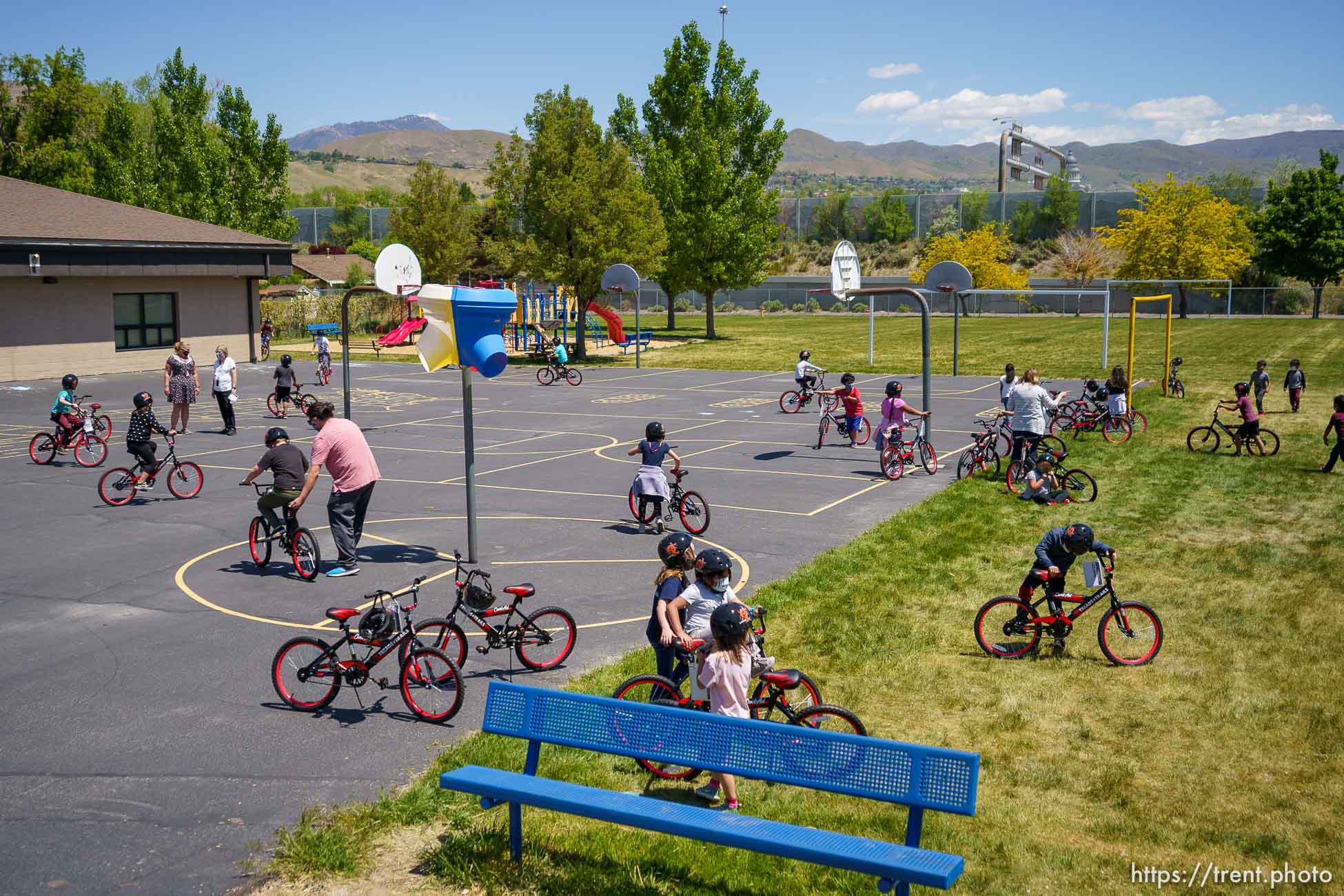 (Trent Nelson  |  The Salt Lake Tribune) Volunteers with Can’d Aid, a non-profit, hand out sixty bikes to 1st grade students at Mary W. Jackson Elementary in Salt Lake City on Thursday, May 13, 2021.