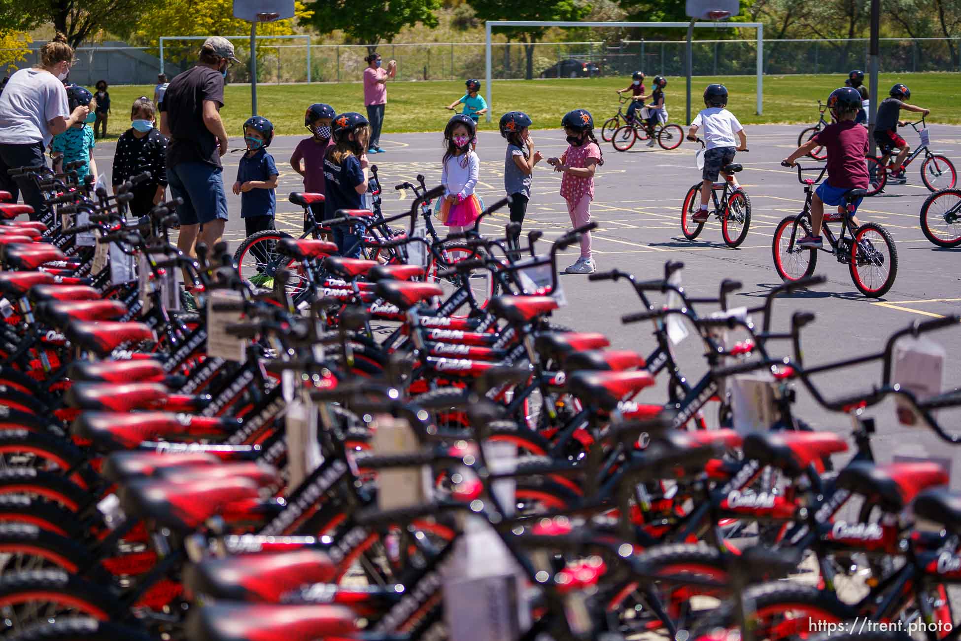 (Trent Nelson  |  The Salt Lake Tribune) Volunteers with Can’d Aid, a non-profit, hand out sixty bikes to 1st grade students at Mary W. Jackson Elementary in Salt Lake City on Thursday, May 13, 2021.