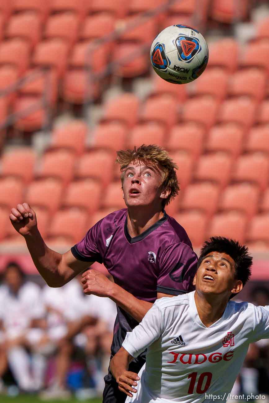 (Trent Nelson  |  The Salt Lake Tribune) Morgan's Cameron  Burt and Judge Memorial's Anthony Galindo leap for the ball in the 3A boys soccer championship, at Rio Tinto Stadium in Sandy on Tuesday, May 18, 2021.