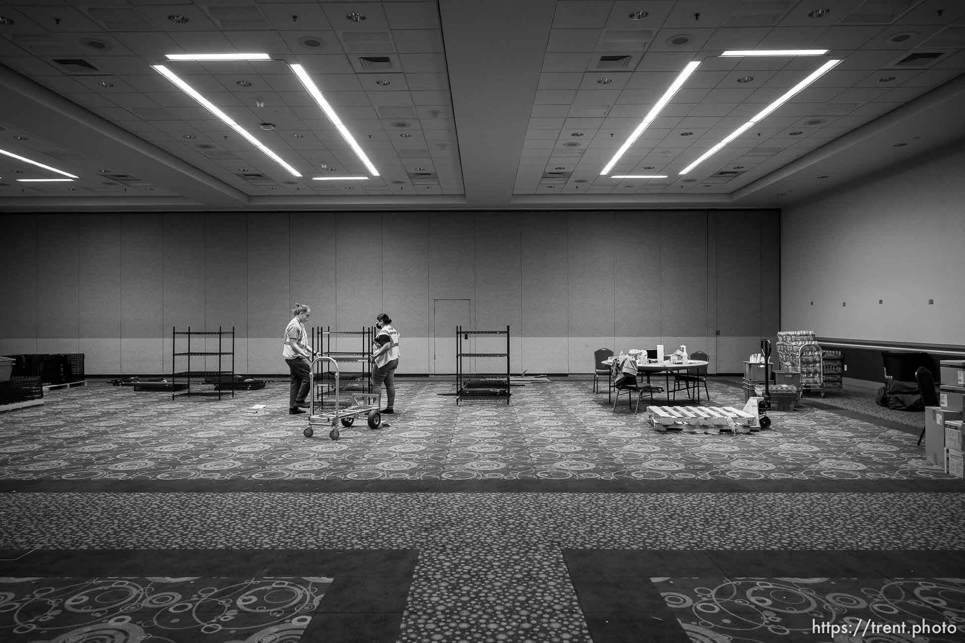 (Trent Nelson  |  The Salt Lake Tribune) Maria Guzman and Kai Pakulski break down a supply room on the last day the Salt Lake County Health Department's COVID-19 vaccine operation was open at the Salt Palace Convention Center in Salt Lake City, Saturday, May 29, 2021.