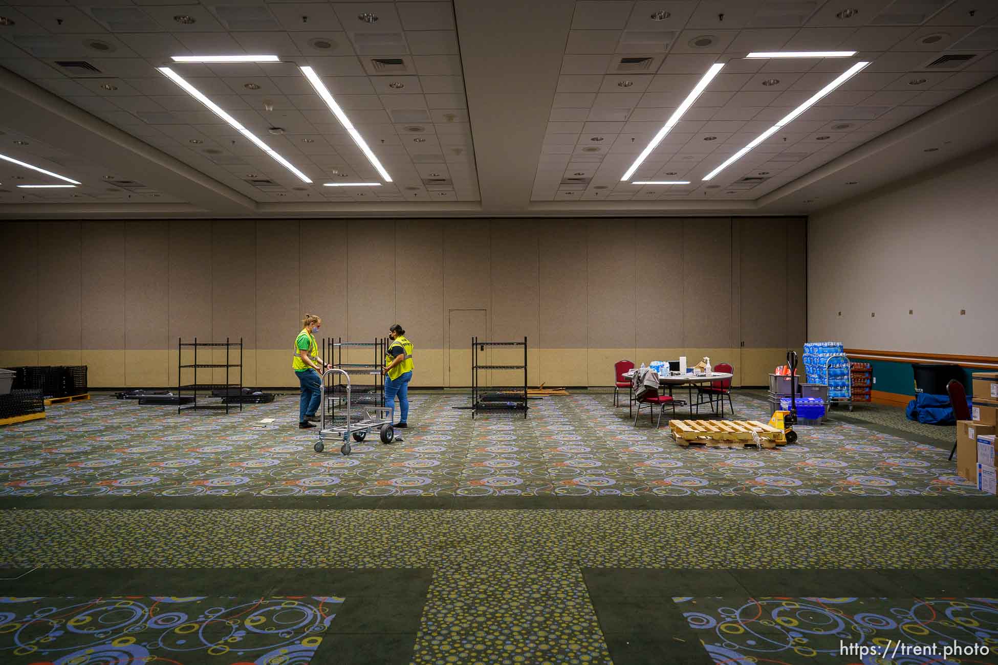 (Trent Nelson  |  The Salt Lake Tribune) Maria Guzman and Kai Pakulski break down a supply room on the last day the Salt Lake County Health Department's COVID-19 vaccine operation was open at the Salt Palace Convention Center in Salt Lake City, Saturday, May 29, 2021.