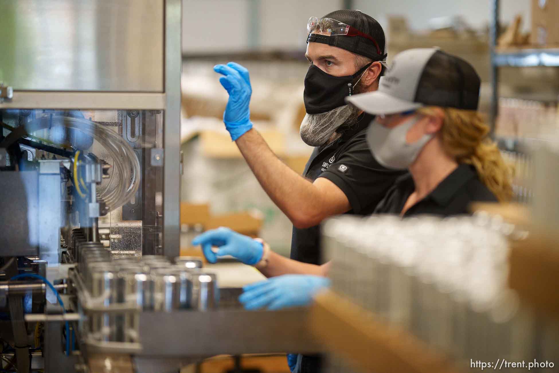 (Trent Nelson  |  The Salt Lake Tribune) Chris and Rebecca Weed working the line canning cocktails at Simplicity Canned Cocktails in Salt Lake City on Monday, May 17, 2021.