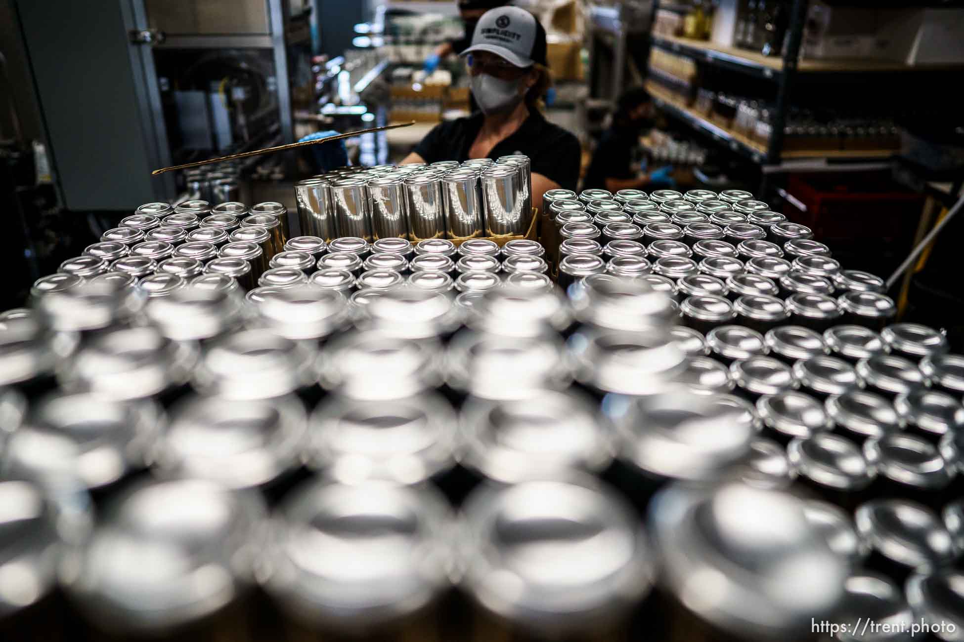 (Trent Nelson  |  The Salt Lake Tribune) Rebecca Weed working the line canning cocktails at Simplicity Canned Cocktails in Salt Lake City on Monday, May 17, 2021.