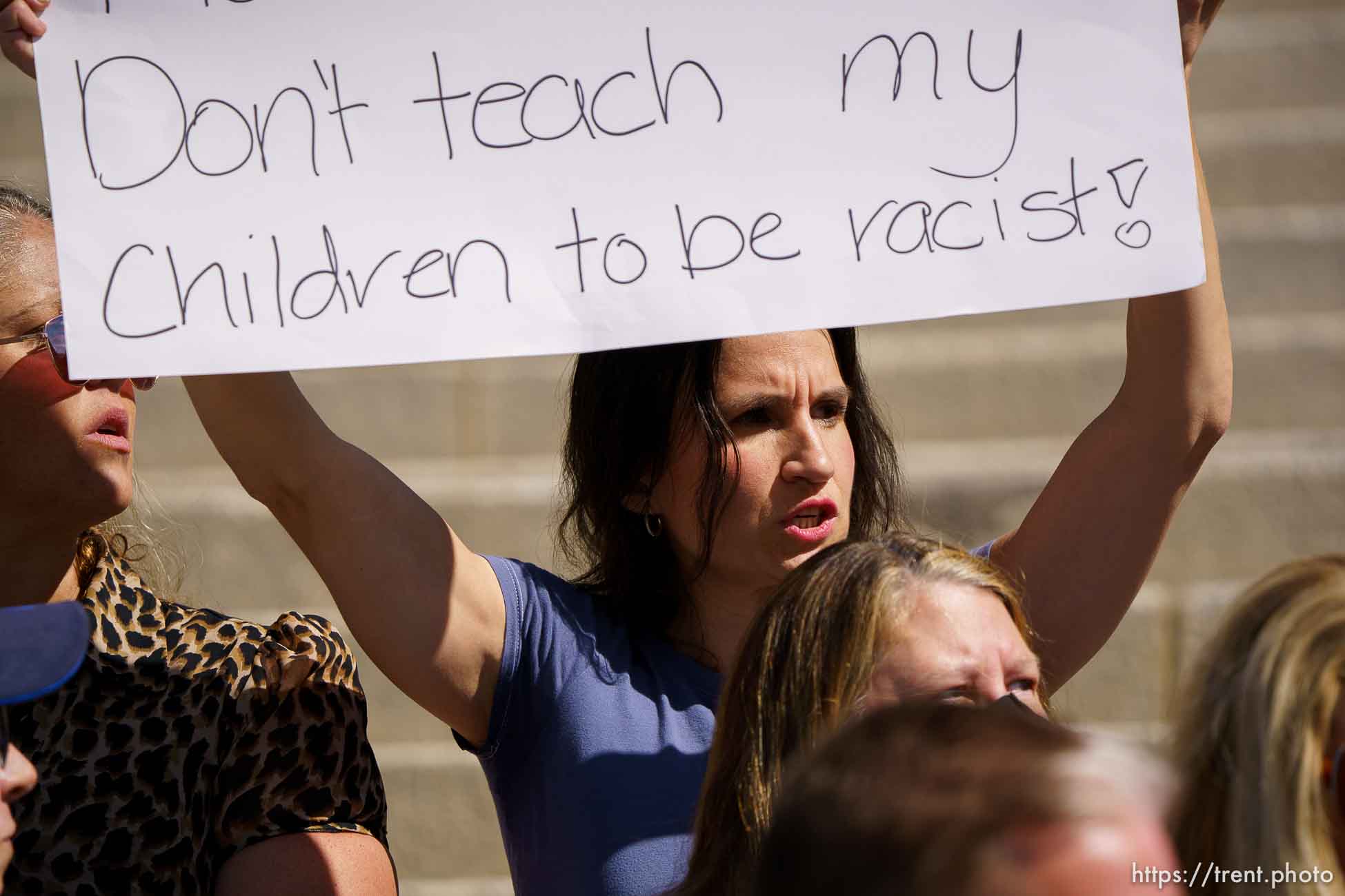 (Trent Nelson  |  The Salt Lake Tribune) Sophia Anderson holds up a sign with the opposite opinion during a news conference by the Utah Educational Equity Coalition at the State Capitol in Salt Lake City on Wednesday, May 19, 2021.