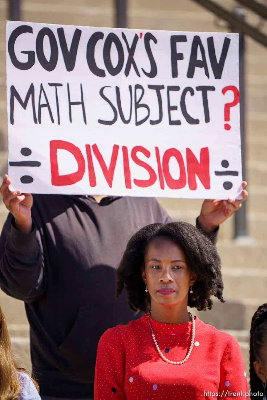 (Trent Nelson  |  The Salt Lake Tribune) People stand behind Michelle Love-Day holding opposing signs during a news conference by the Utah Educational Equity Coalition at the State Capitol in Salt Lake City on Wednesday, May 19, 2021.