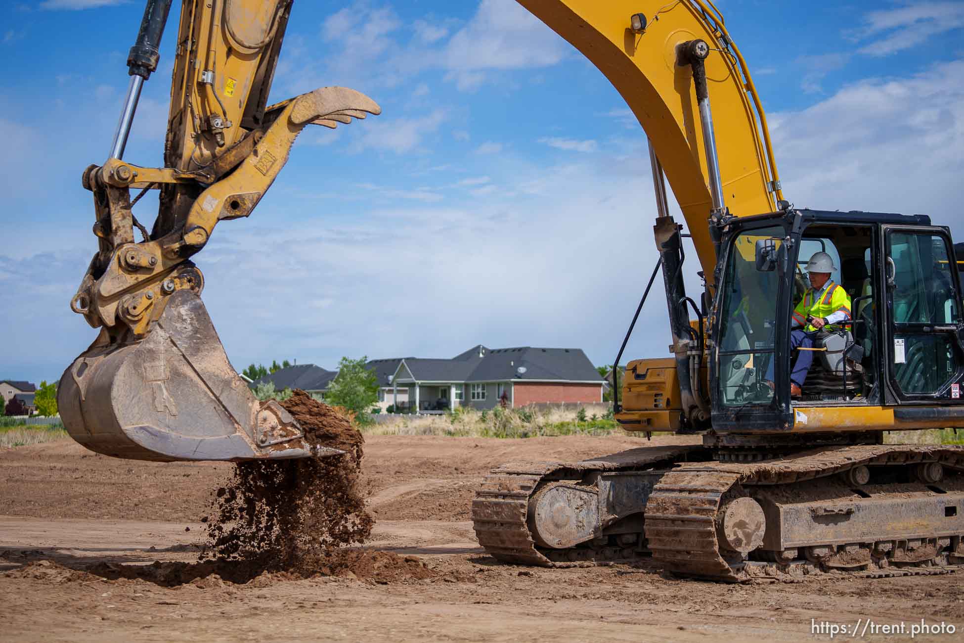 (Trent Nelson  |  The Salt Lake Tribune)  Senate President Stuart Adams, R-Layton, turns dirt with an excavator as UDOT kicks off construction of the West Davis Highway with an event in Layton on Tuesday, May 25, 2021.