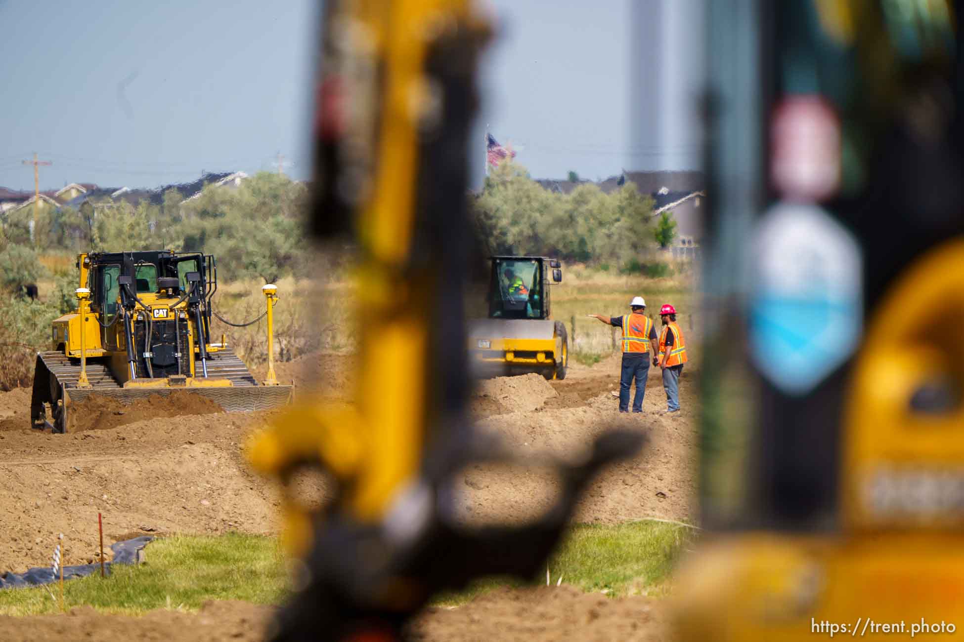 (Trent Nelson  |  The Salt Lake Tribune) Heavy equipment works on the West Davis Highway project in Layton on Tuesday, May 25, 2021.