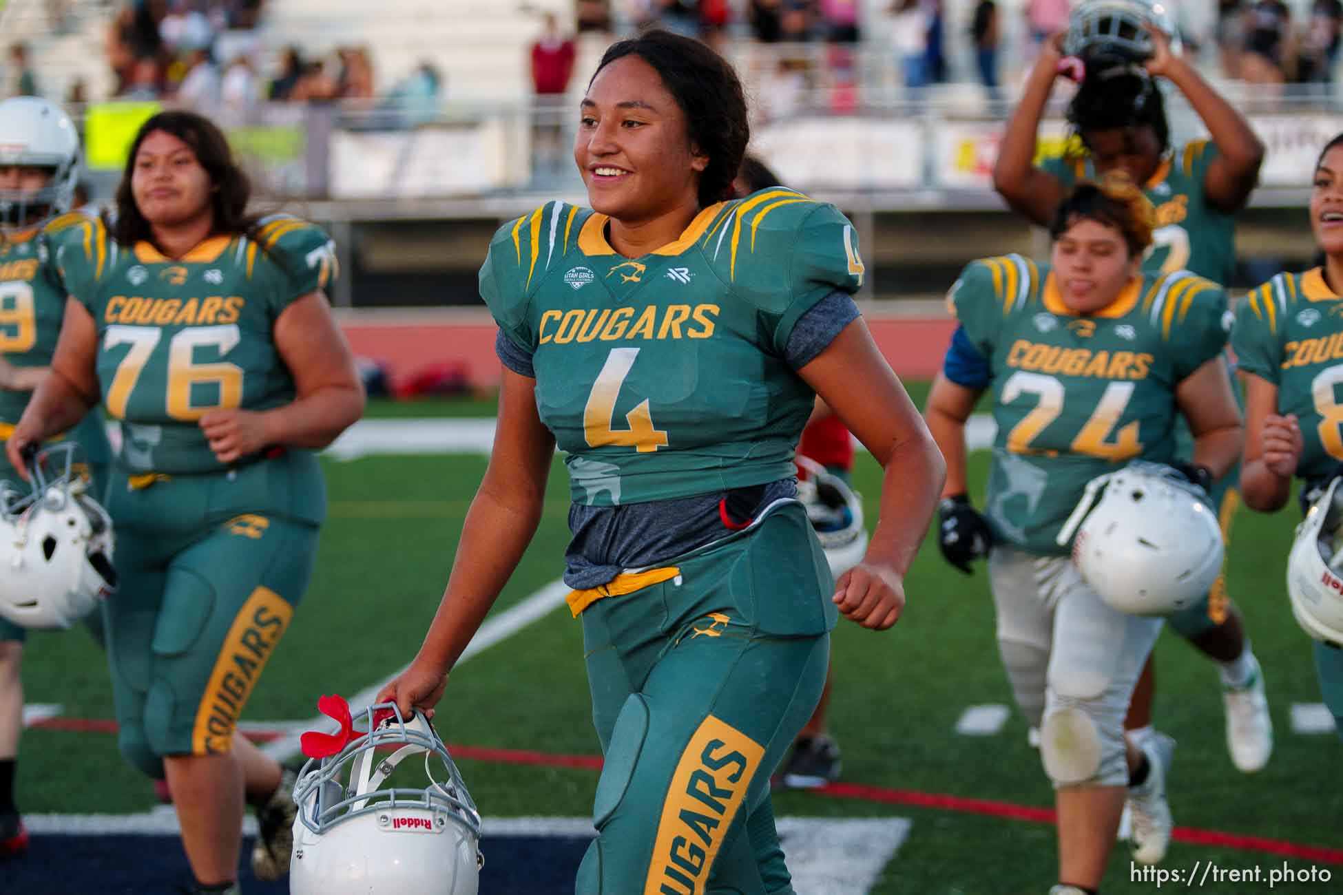 (Trent Nelson  |  The Salt Lake Tribune) Kearns players celebrate their win over the Herriman Sting in the Utah Girls Tackle Football League Division 2 championship game at Herriman High School on Thursday, May 27, 2021. At center is Lionala Mayorga.