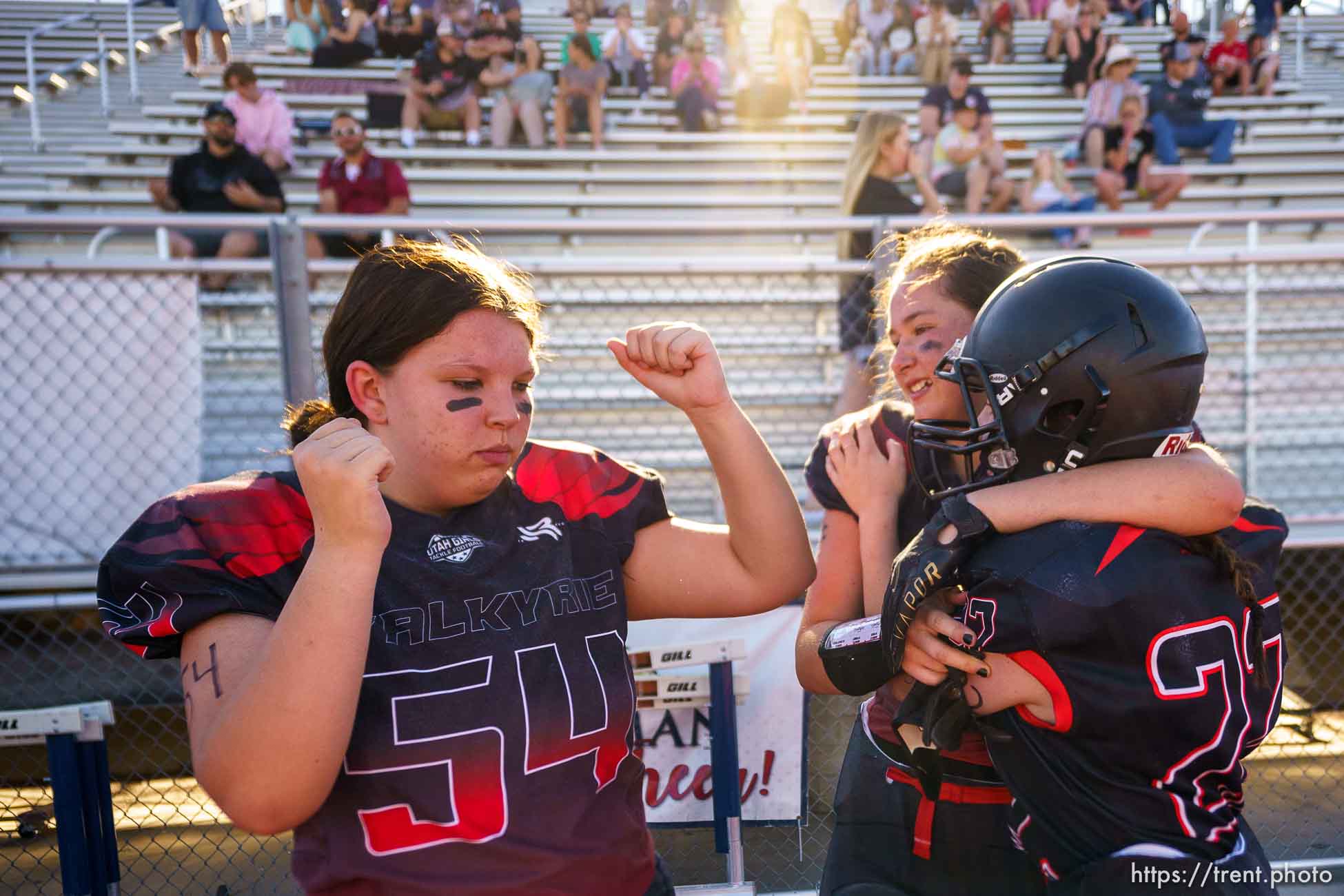 (Trent Nelson  |  The Salt Lake Tribune) Utah Valley's Brinley Hunter, Ruby Canlas (16), and Mae Huish during halftime as the Utah Valley Valkyrie face the West Jordan Lightning in the Utah Girls Tackle Football League Division 3 championship game at Herriman High School on Thursday, May 27, 2021.