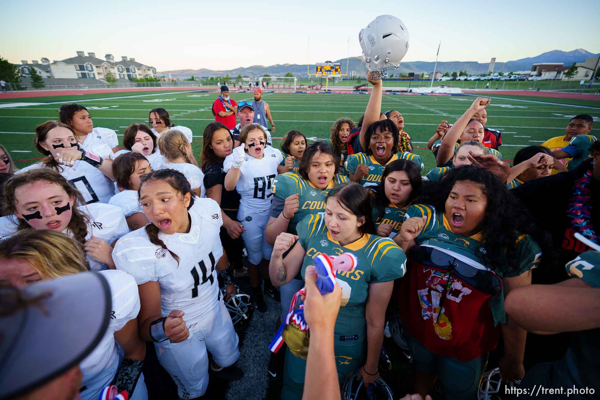 (Trent Nelson  |  The Salt Lake Tribune) 
Players from Herriman and Kearns gather after their game in the Utah Girls Tackle Football League Division 3 championship game at Herriman High School on Thursday, May 27, 2021.