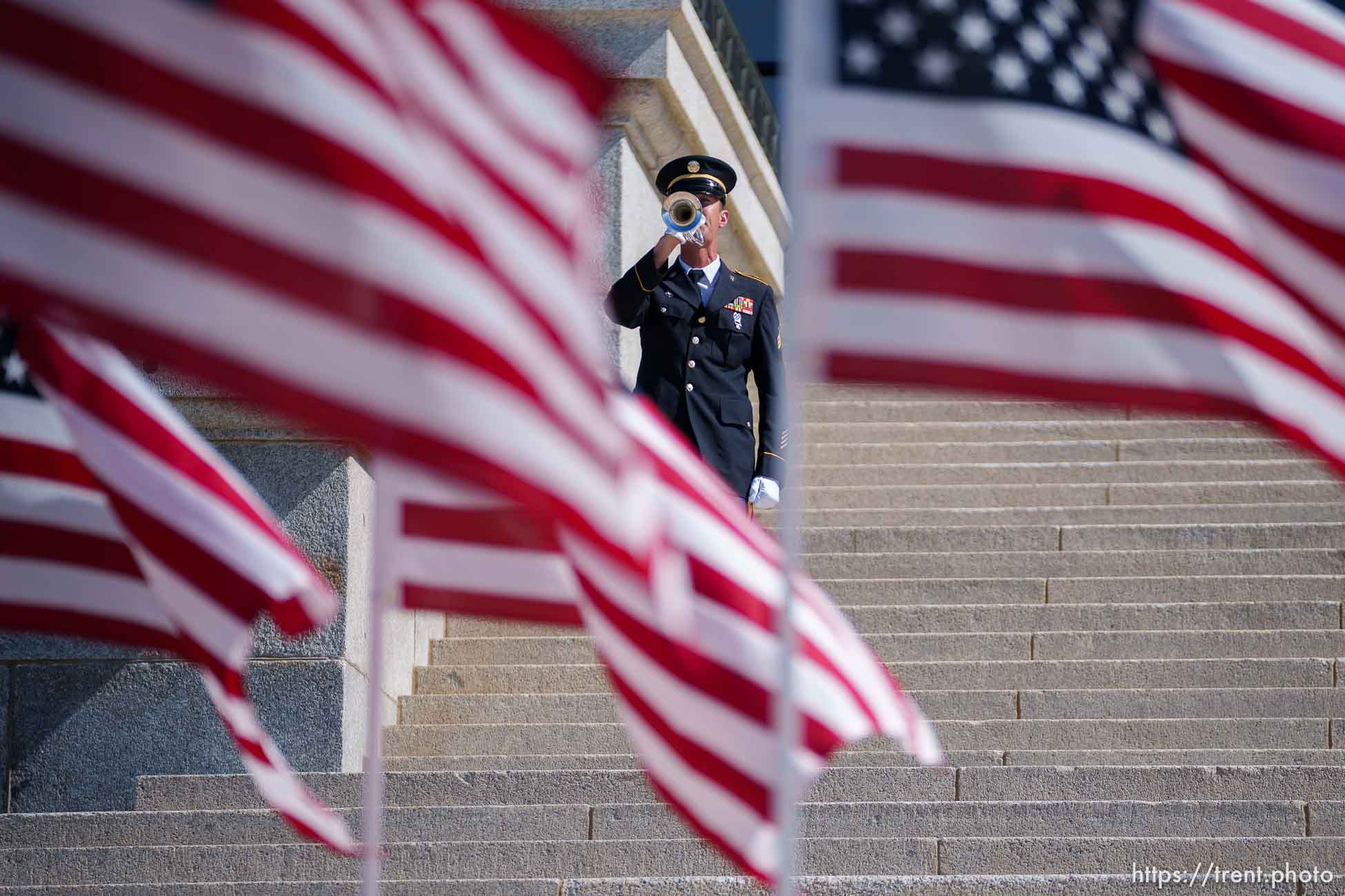 i(Trent Nelson  |  The Salt Lake Tribune) Sgt. Aaron Reynolds performs taps to honor veterans during a service at the State Capitol in Salt Lake City on Monday, May 31, 2021.