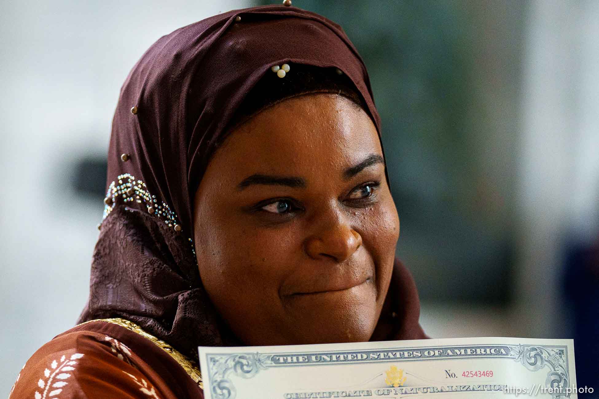 (Trent Nelson  |  The Salt Lake Tribune) New citizen Zainab Masud displays her naturalization certificate during a naturalization ceremony that was part of Utah’s World Refugee Week celebration, in Salt Lake City on Tuesday, June 15, 2021.