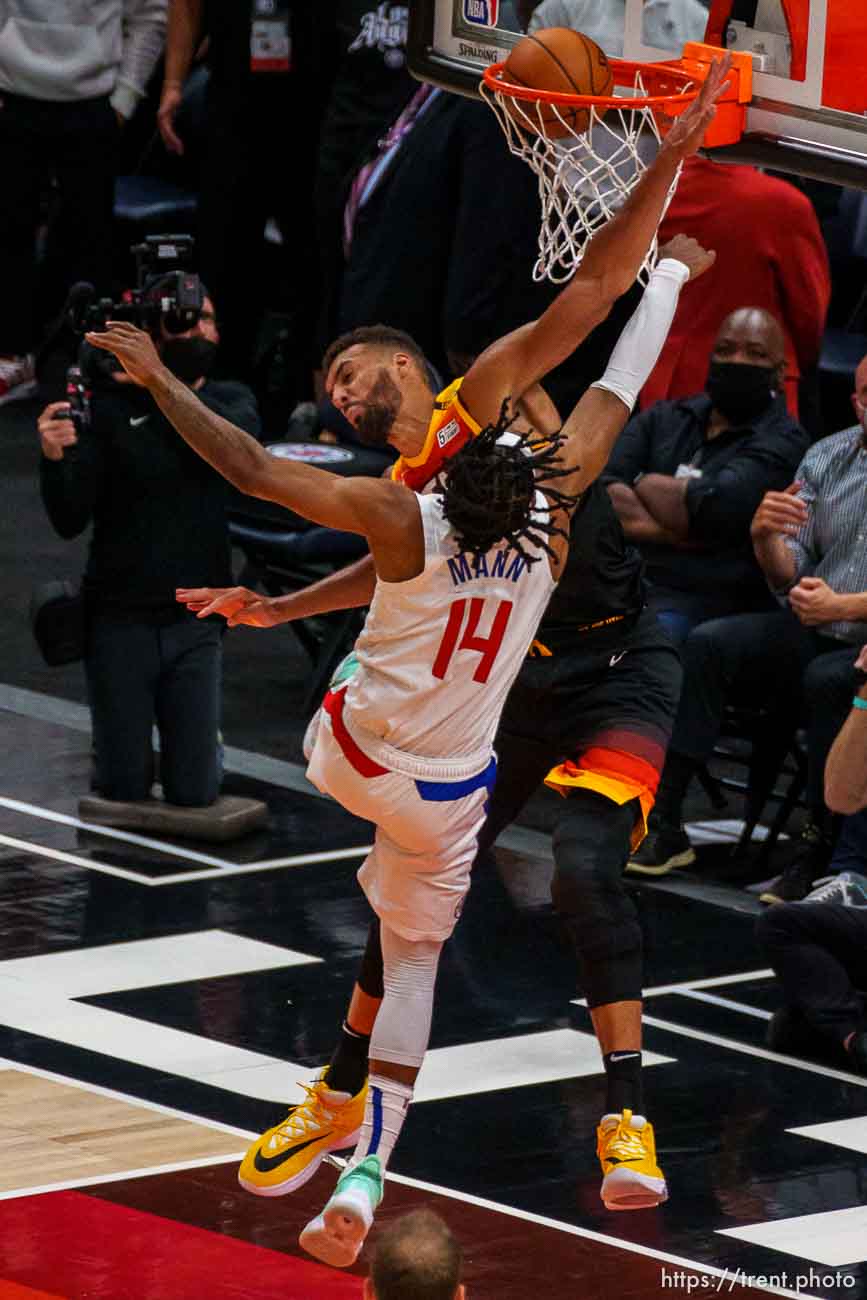 (Trent Nelson  |  The Salt Lake Tribune) LA Clippers guard Terance Mann (14) dunks and is fouled by Utah Jazz center Rudy Gobert (27) as the Utah Jazz host the Los Angeles Clippers in a Game 5 matchup, NBA basketball in Salt Lake City on Wednesday, June 16, 2021.