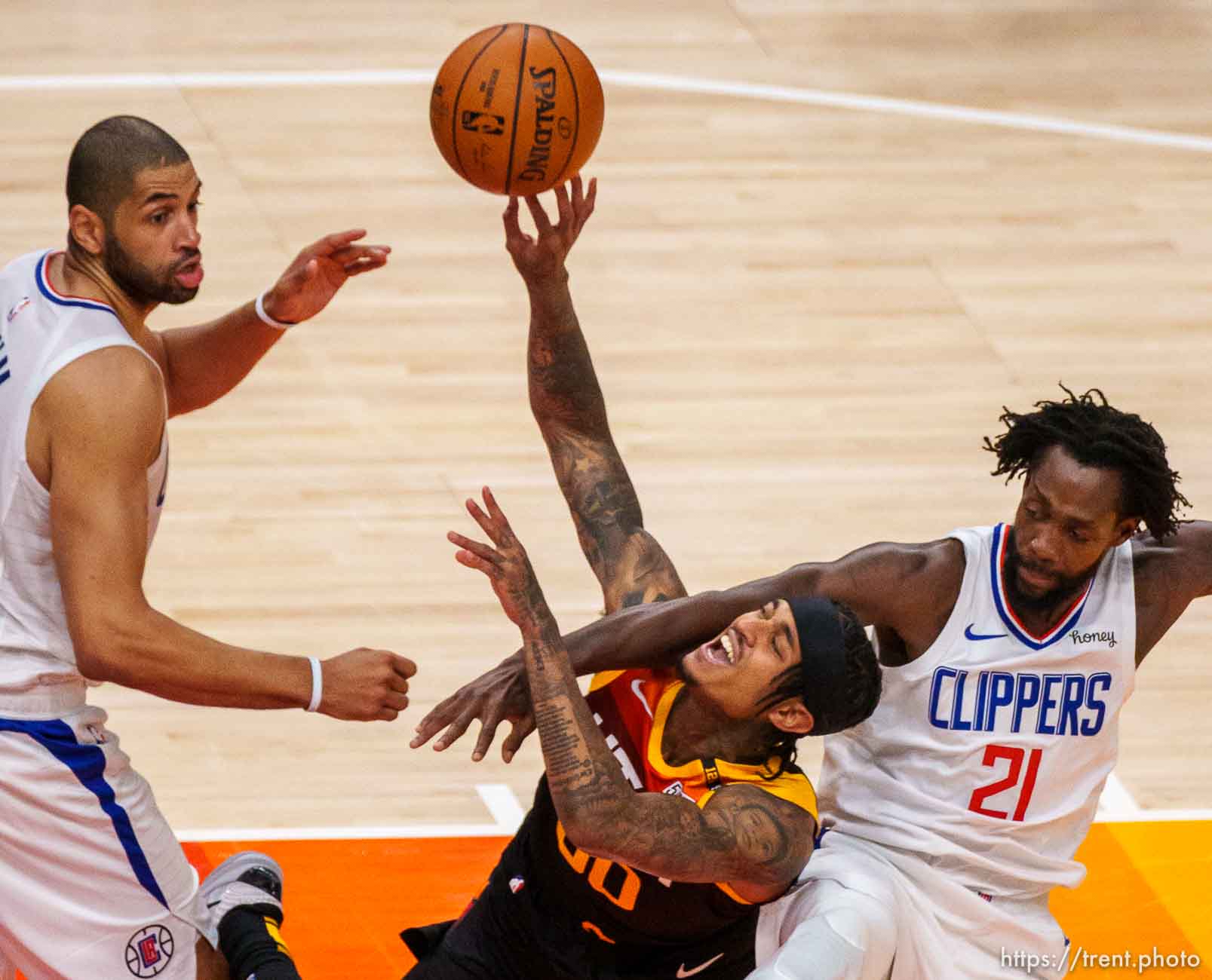 (Trent Nelson  |  The Salt Lake Tribune) LA Clippers guard Patrick Beverley (21) fouls Utah Jazz guard Jordan Clarkson (00) as the Utah Jazz host the Los Angeles Clippers in a Game 5 matchup, NBA basketball in Salt Lake City on Wednesday, June 16, 2021.