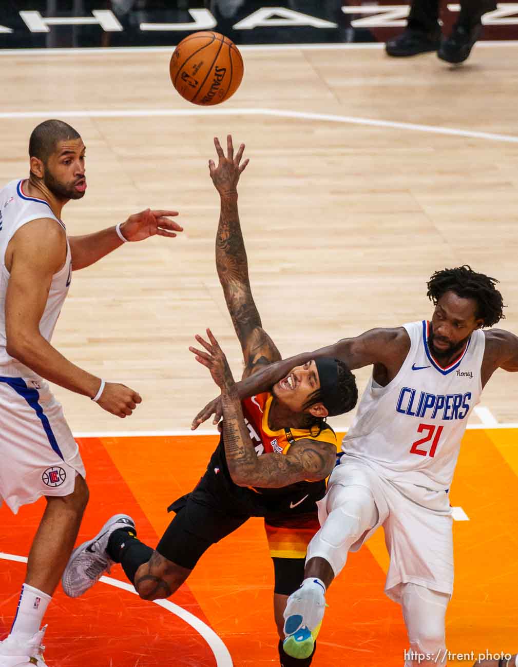 (Trent Nelson  |  The Salt Lake Tribune) LA Clippers guard Patrick Beverley (21) fouls Utah Jazz guard Jordan Clarkson (00) as the Utah Jazz host the Los Angeles Clippers in a Game 5 matchup, NBA basketball in Salt Lake City on Wednesday, June 16, 2021.