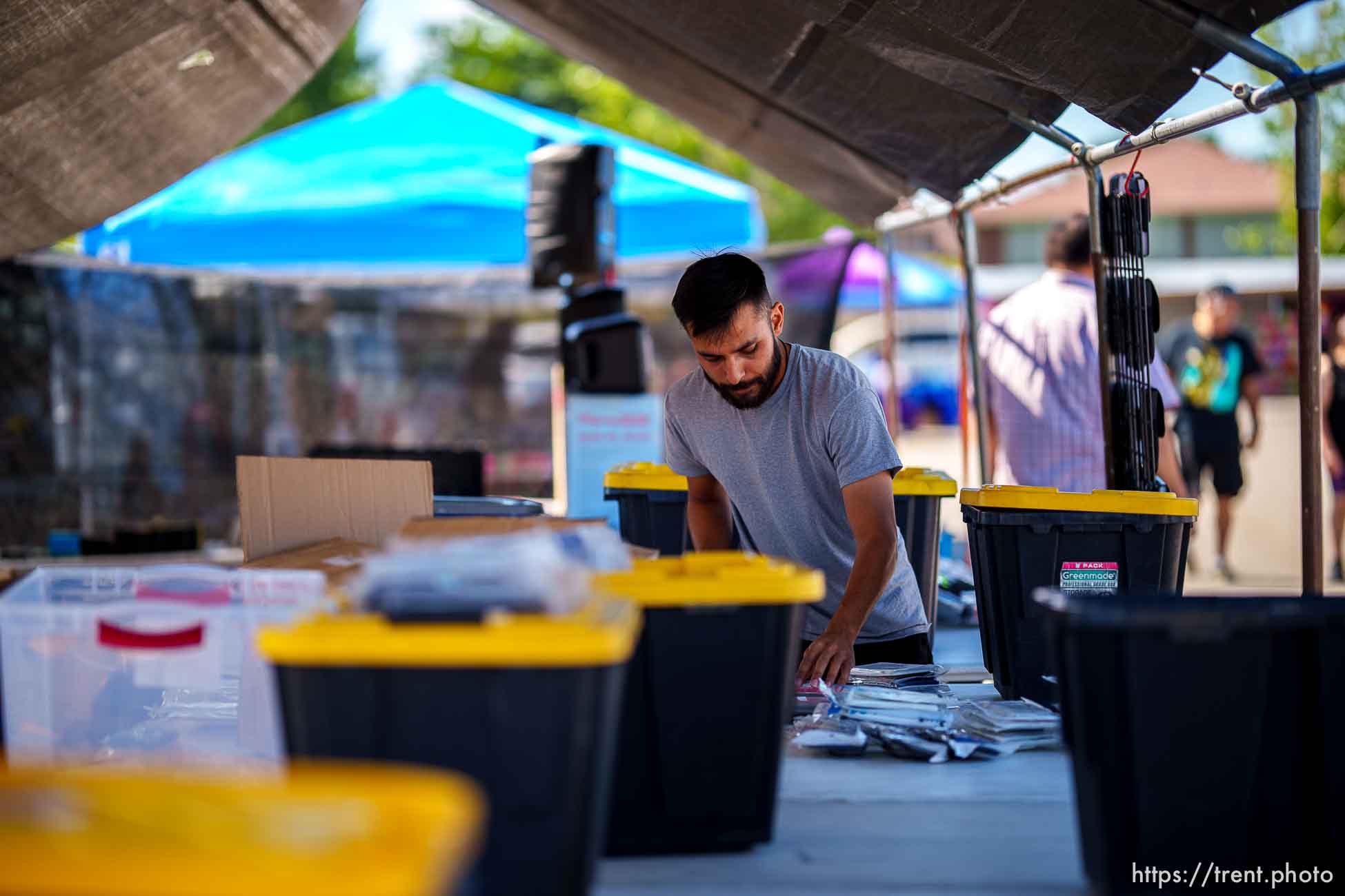 (Trent Nelson  |  The Salt Lake Tribune) Julian Sanchez stocks his booth at the swap meet at the Redwood Drive In Theatre & Swap Meet in West Valley City on Saturday, June 26, 2021.