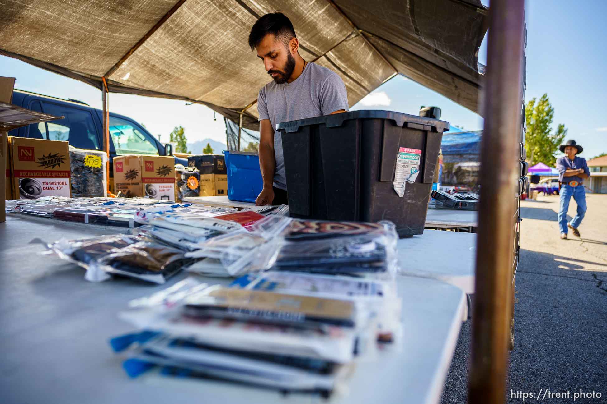 (Trent Nelson  |  The Salt Lake Tribune) Julian Sanchez stocks his booth at the swap meet at the Redwood Drive In Theatre & Swap Meet in West Valley City on Saturday, June 26, 2021.