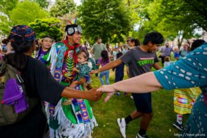 (Trent Nelson  |  The Salt Lake Tribune) The crowd joins dancers in a friendship dance during an intertribal pow wow at the Living Traditions festival in Salt Lake City on Saturday, June 26, 2021.