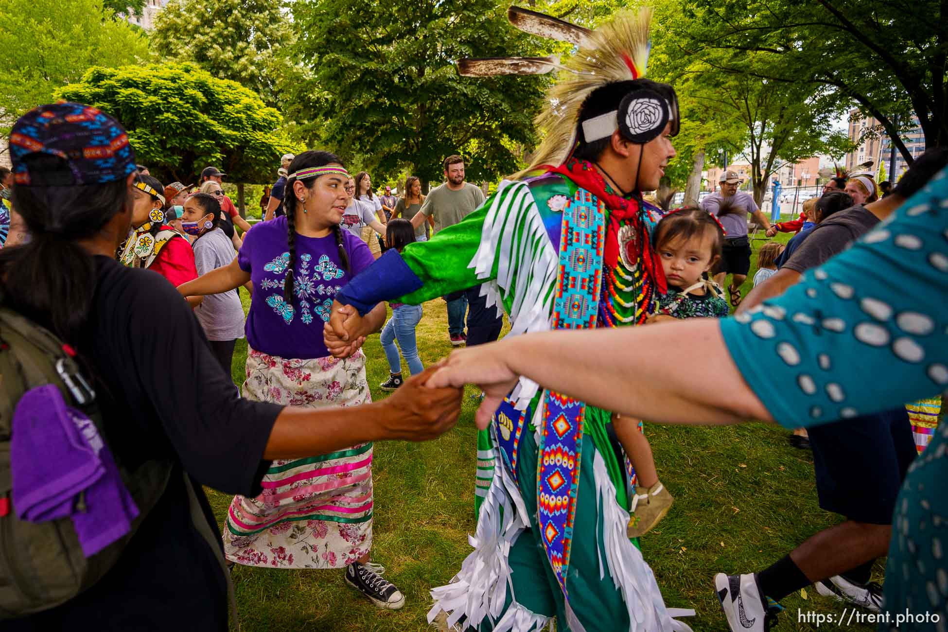 (Trent Nelson  |  The Salt Lake Tribune) The crowd joins dancers in a friendship dance during an intertribal pow wow at the Living Traditions festival in Salt Lake City on Saturday, June 26, 2021.