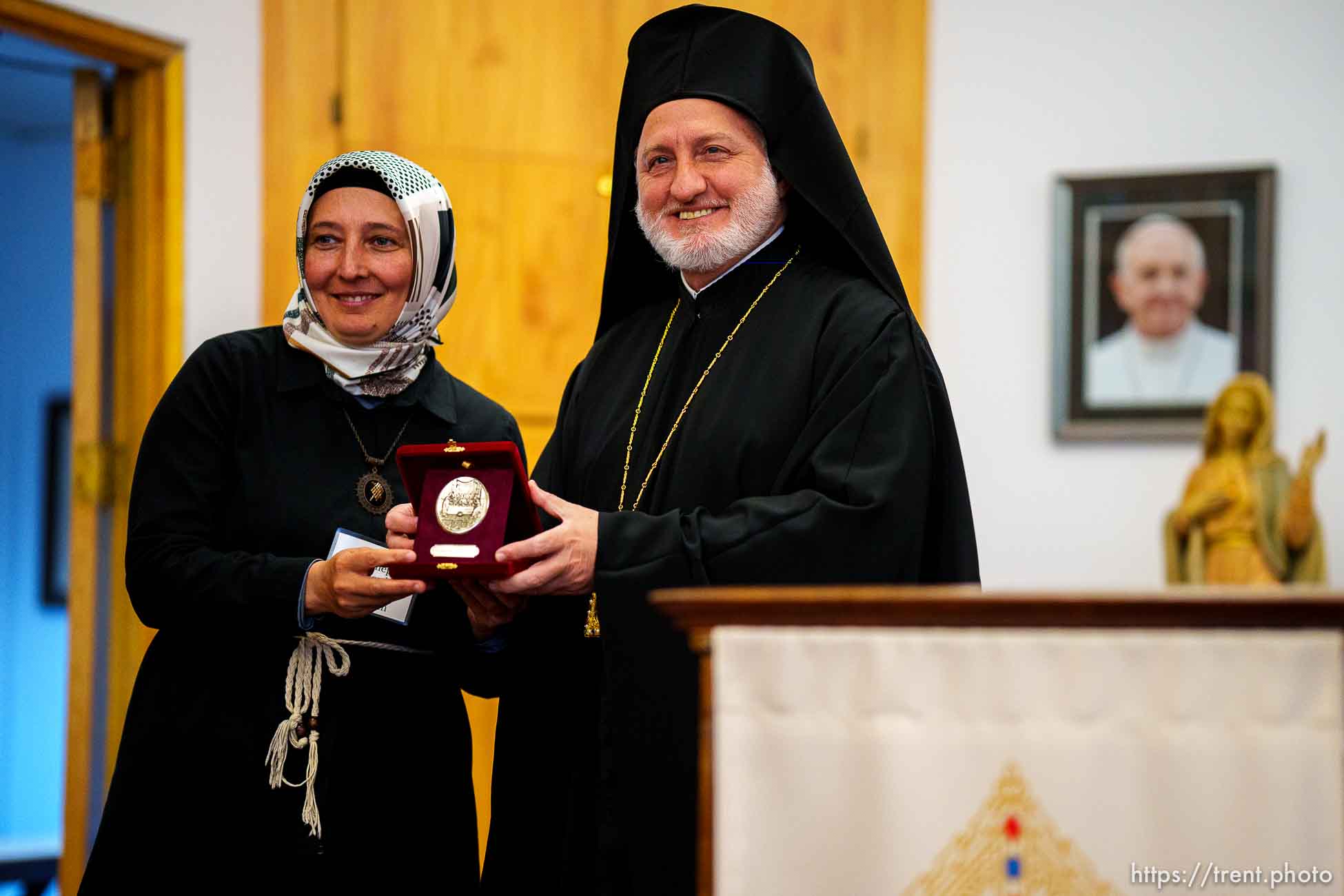 (Trent Nelson  |  The Salt Lake Tribune) His Eminence Archbishop Elpidophoros of America  presents a medallion to Zeynep Karipardue during a visit to the Cathedral of the Madeleine in Salt Lake City on Tuesday, July 20, 2021.