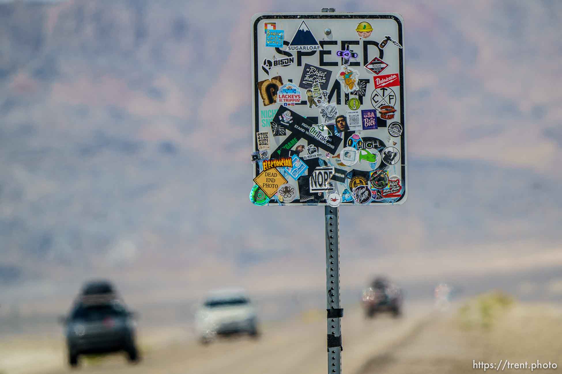 (Trent Nelson  |  The Salt Lake Tribune) A speed limit sign plastered with stickers at the Bonneville Salt Flats on Saturday, July 31, 2021.