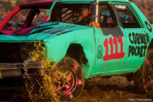 (Trent Nelson  |  The Salt Lake Tribune) Fluid leaks out of Ryan Robinson's car during Punishment at the Peak, a demolition derby in Grantsville on Saturday, Aug. 7, 2021.