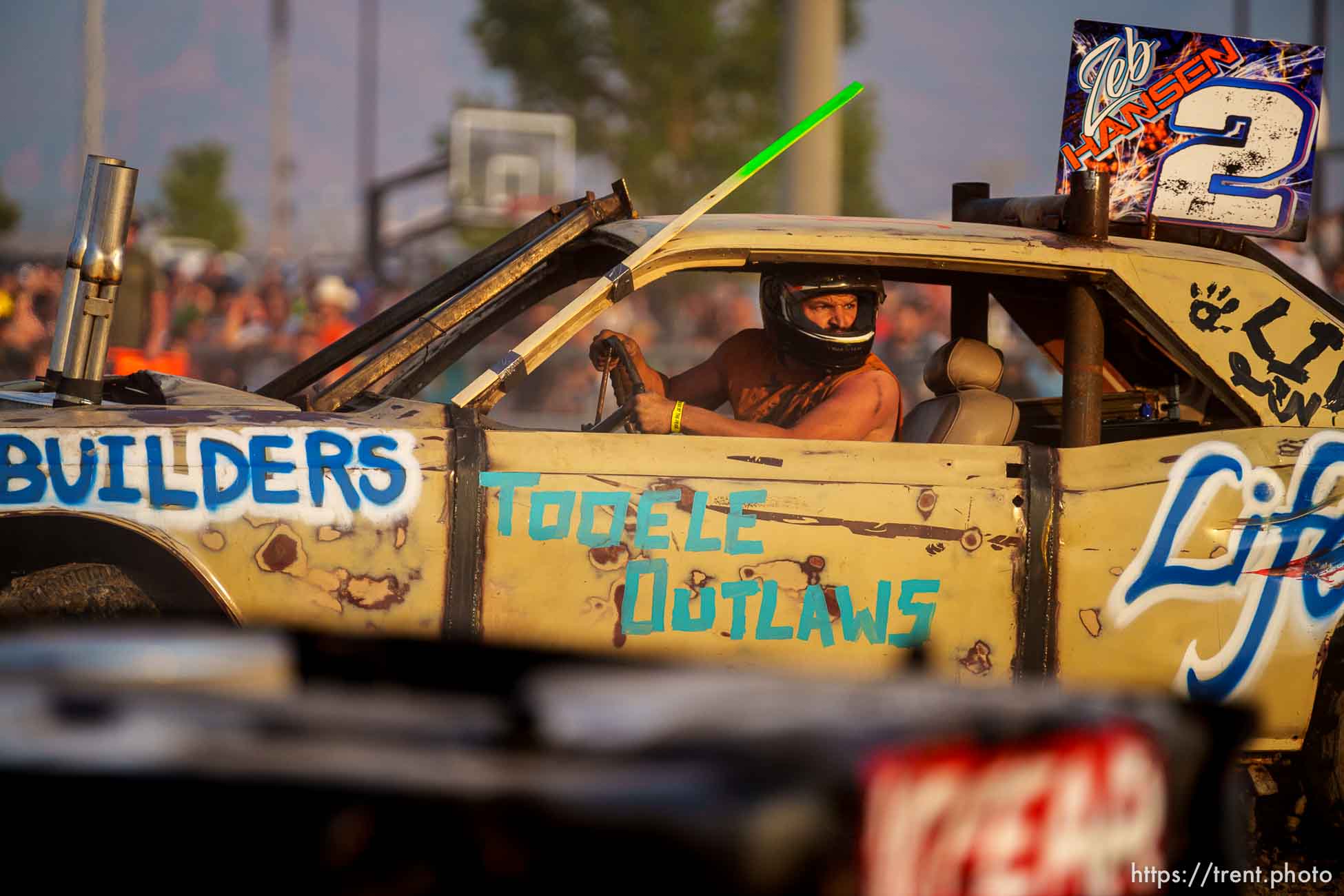 (Trent Nelson  |  The Salt Lake Tribune) Zeb Smith behind the wheel during Punishment at the Peak, a demolition derby in Grantsville on Saturday, Aug. 7, 2021.