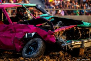 (Trent Nelson  |  The Salt Lake Tribune) Ryan Robinson sits in his stalled car during Punishment at the Peak, a demolition derby in Grantsville on Saturday, Aug. 7, 2021.