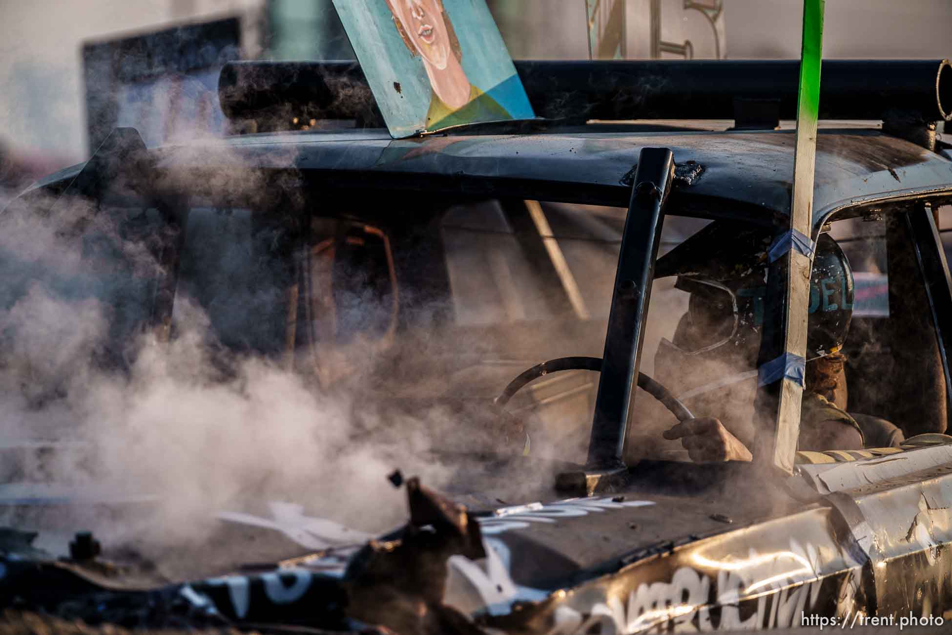 (Trent Nelson  |  The Salt Lake Tribune) Gage Hansen's car steams during Punishment at the Peak, a demolition derby in Grantsville on Saturday, Aug. 7, 2021.