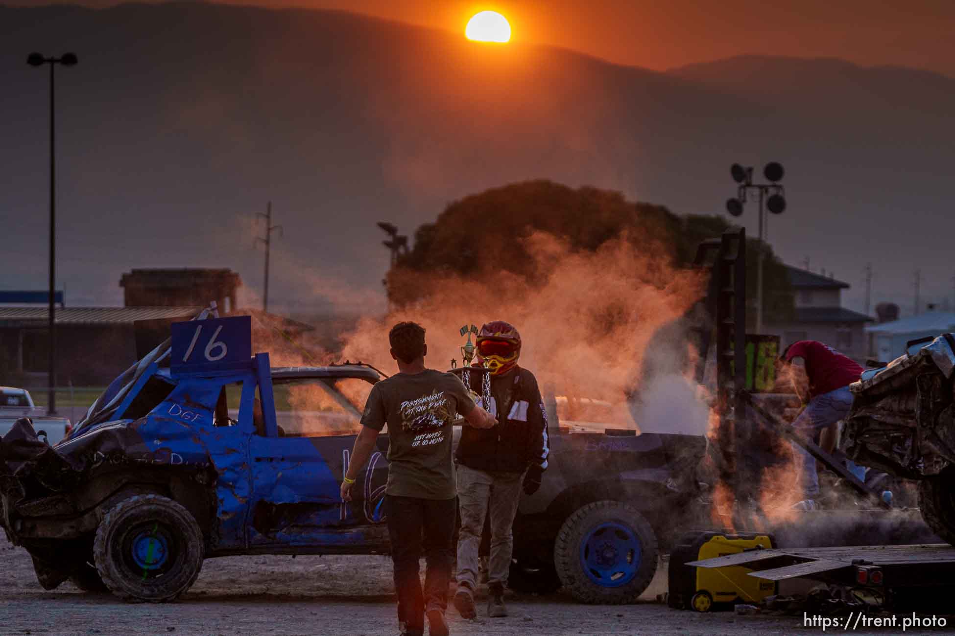 (Trent Nelson  |  The Salt Lake Tribune) Dalton Gullo is handed a trophy during Punishment at the Peak, a demolition derby in Grantsville on Saturday, Aug. 7, 2021.