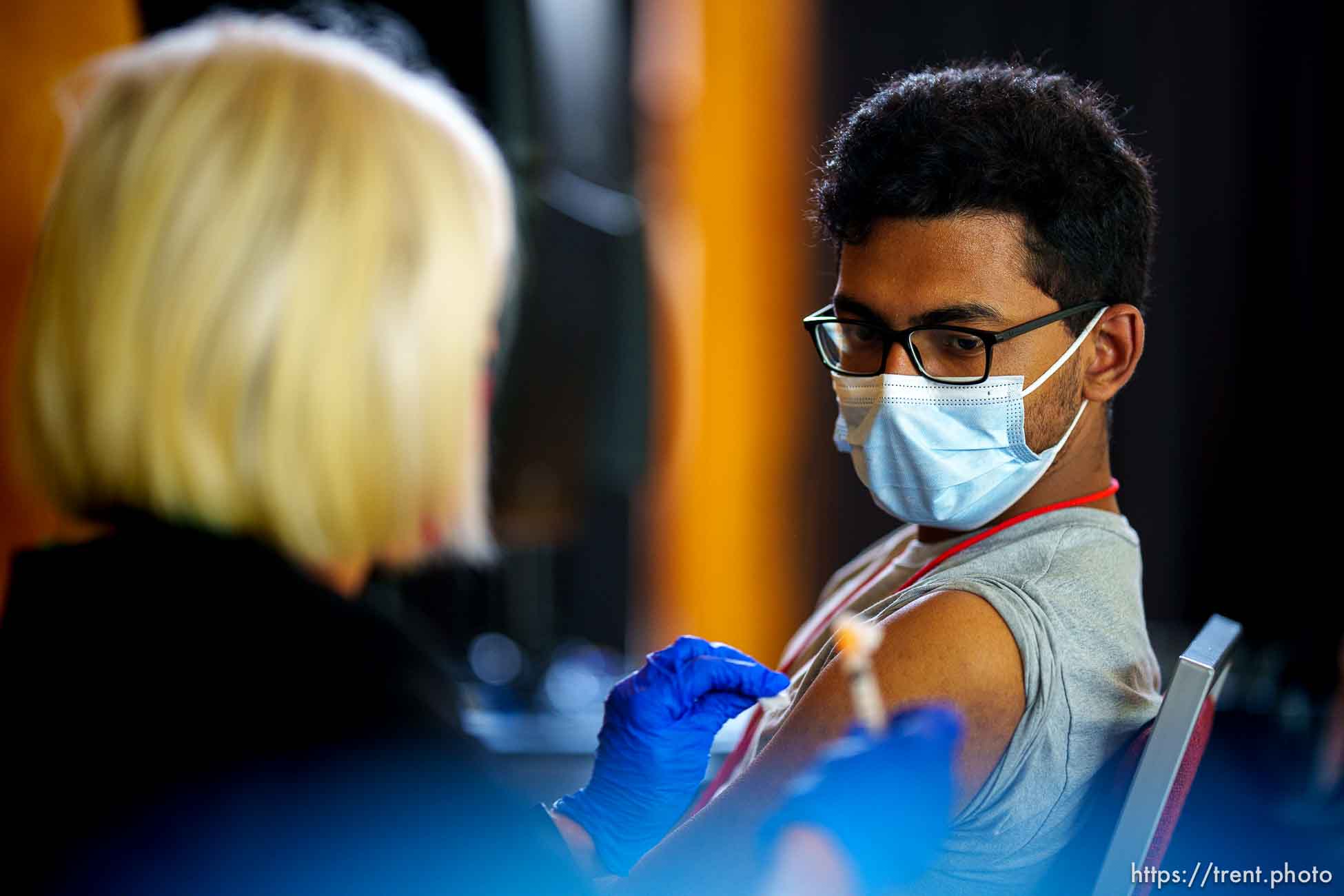 (Trent Nelson  |  The Salt Lake Tribune) Nurse Sue Day administers a COVID-19 vaccine to University of Utah student Dev Banerjee in Salt Lake City on Friday, Aug. 20, 2021.