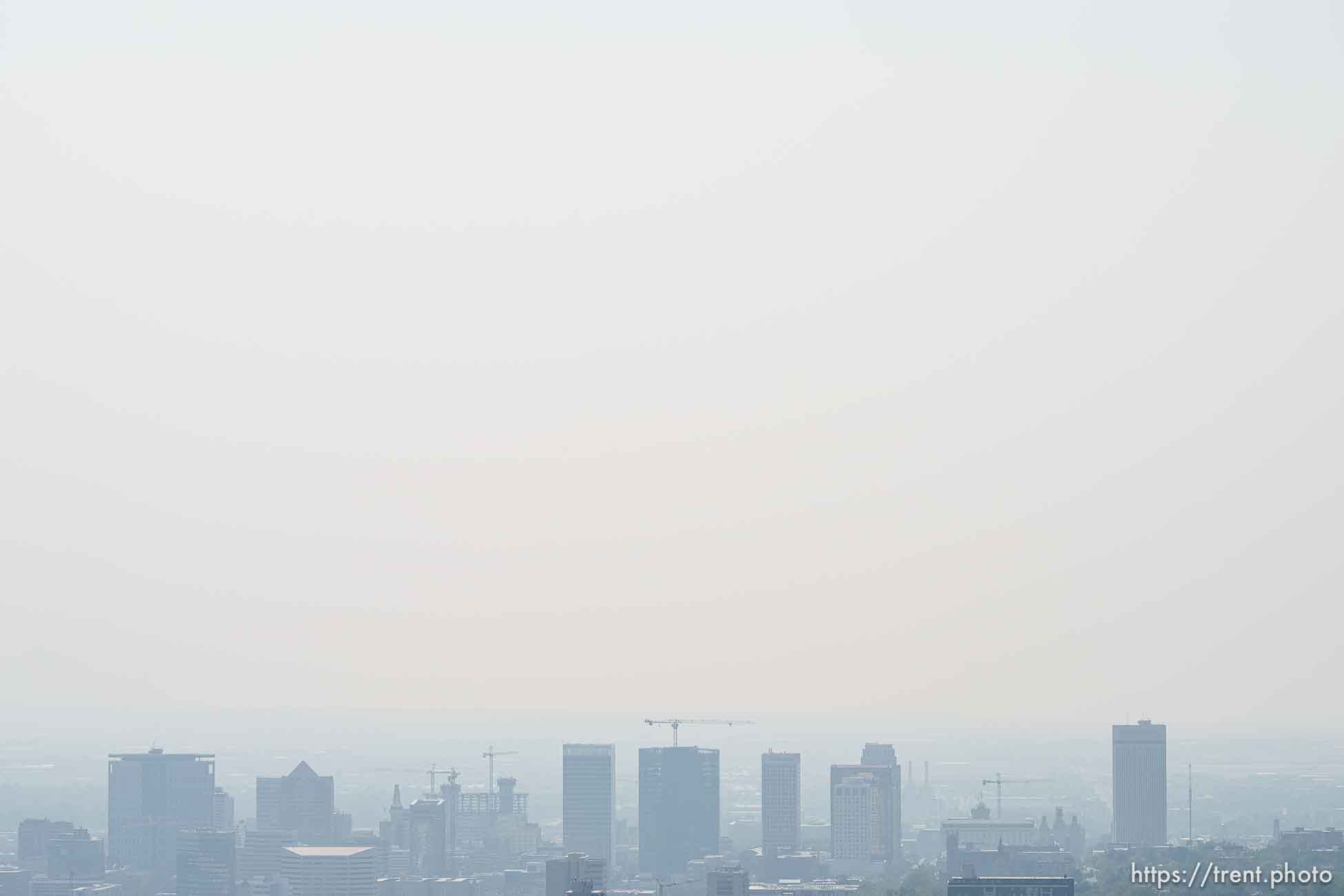 (Trent Nelson  |  The Salt Lake Tribune) Downtown and smoke over Salt Lake City on Friday, Aug. 20, 2021.