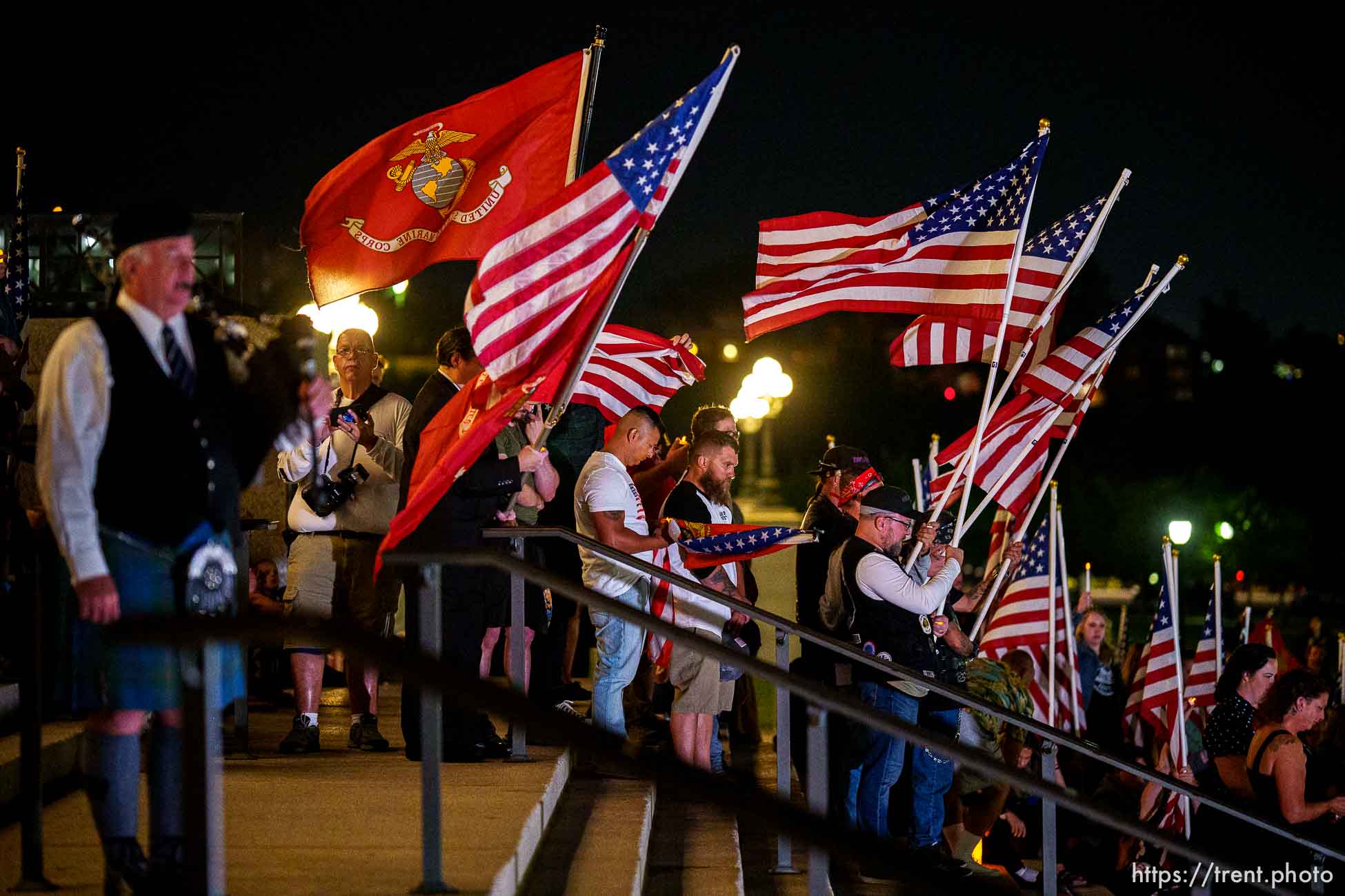 (Trent Nelson  |  The Salt Lake Tribune) People stand for a moment of silence at a vigil at the State Capitol in Salt Lake City for Staff Sgt. Taylor Hoover on Sunday, Aug. 29, 2021. Hoover was killed in a suicide bombing in Kabul, Afghanistan.