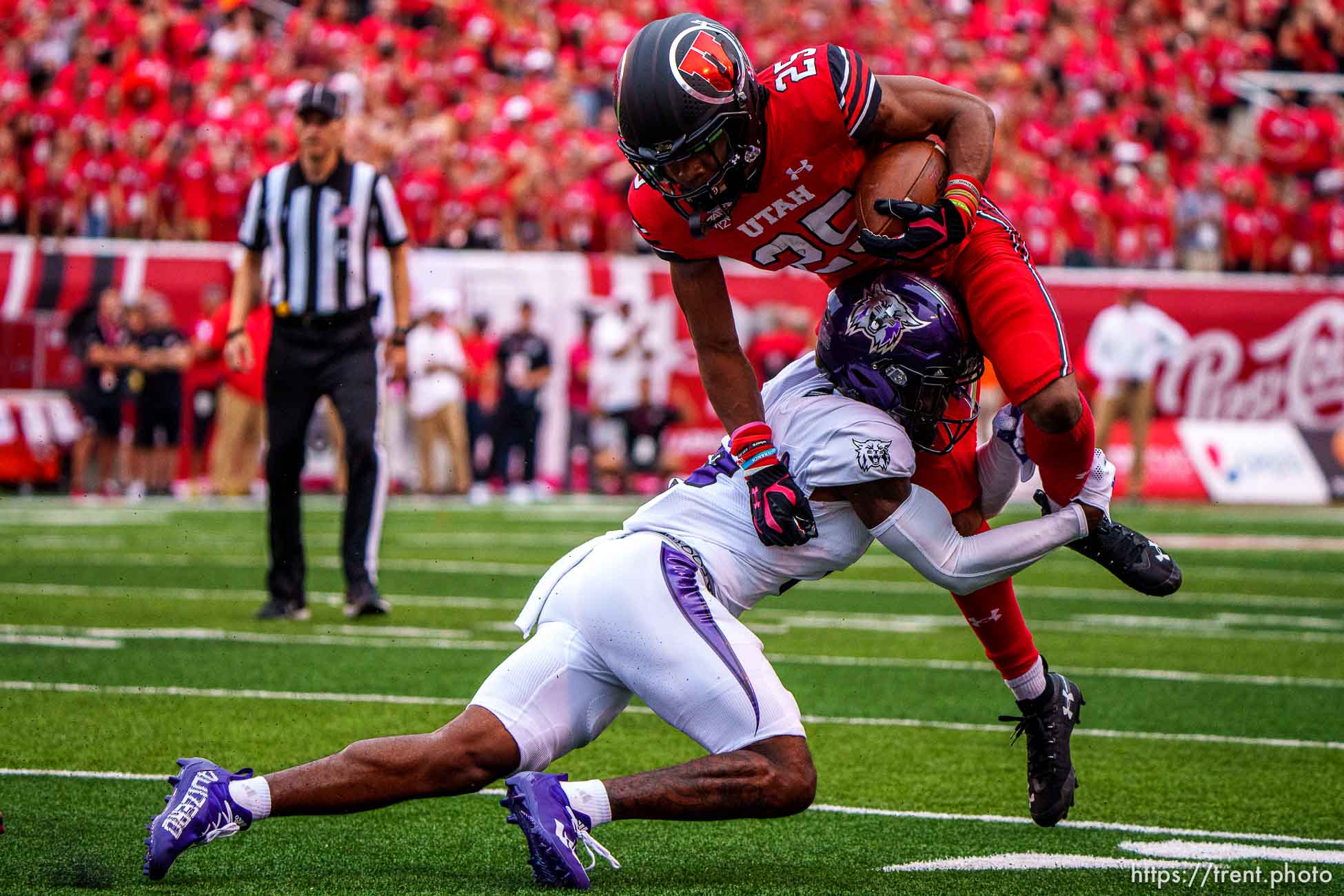 (Trent Nelson  |  The Salt Lake Tribune) Weber State Wildcats cornerback Marque Collins (2) stops Utah Utes wide receiver Jaylen Dixon (25) as the Utah Utes host the Weber State Wildcats in Salt Lake City on Thursday, Sept. 2, 2021.