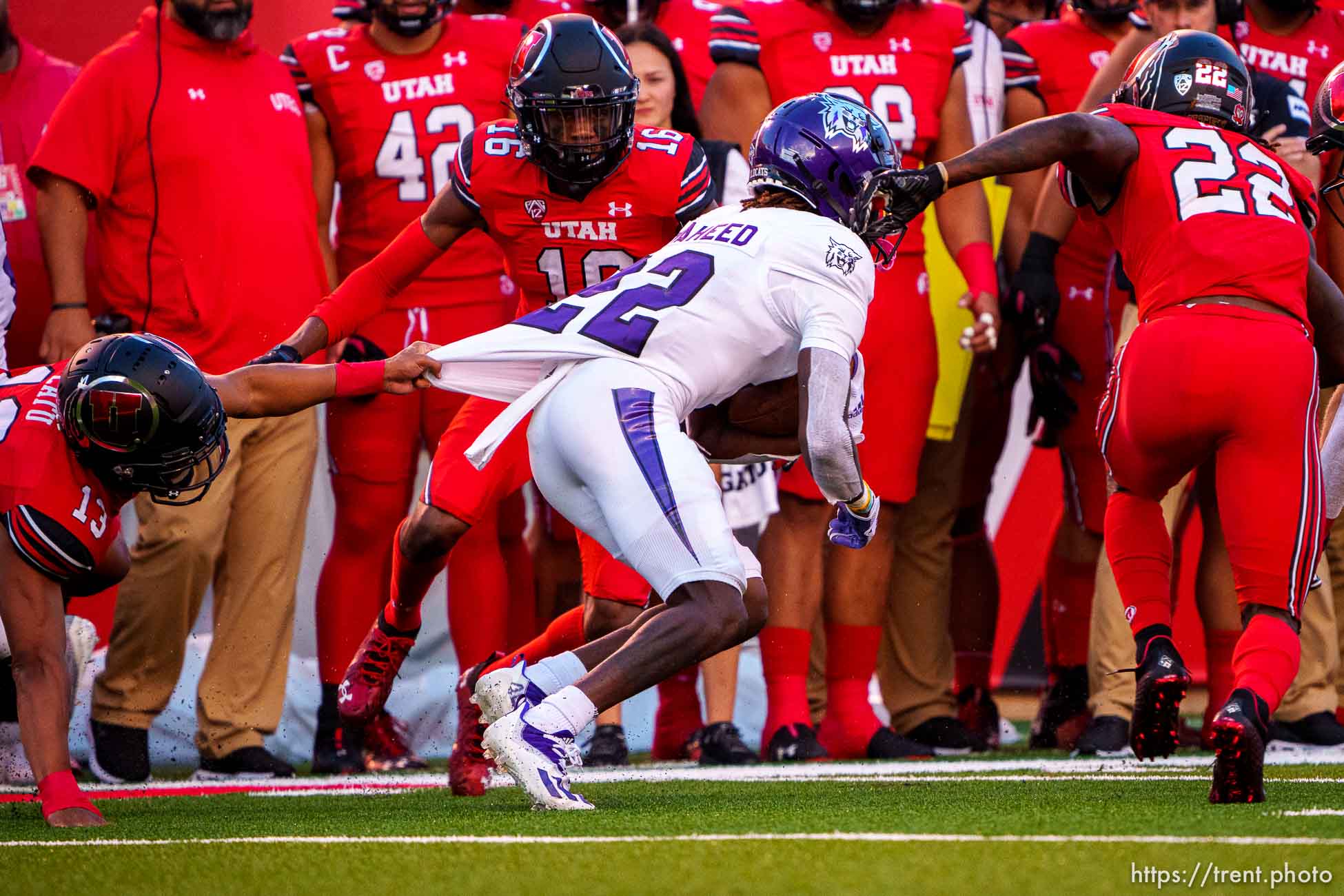 (Trent Nelson  |  The Salt Lake Tribune) Utah defenders stop Weber State Wildcats wide receiver Rashid Shaheed (22) as the Utah Utes host the Weber State Wildcats in Salt Lake City on Thursday, Sept. 2, 2021.