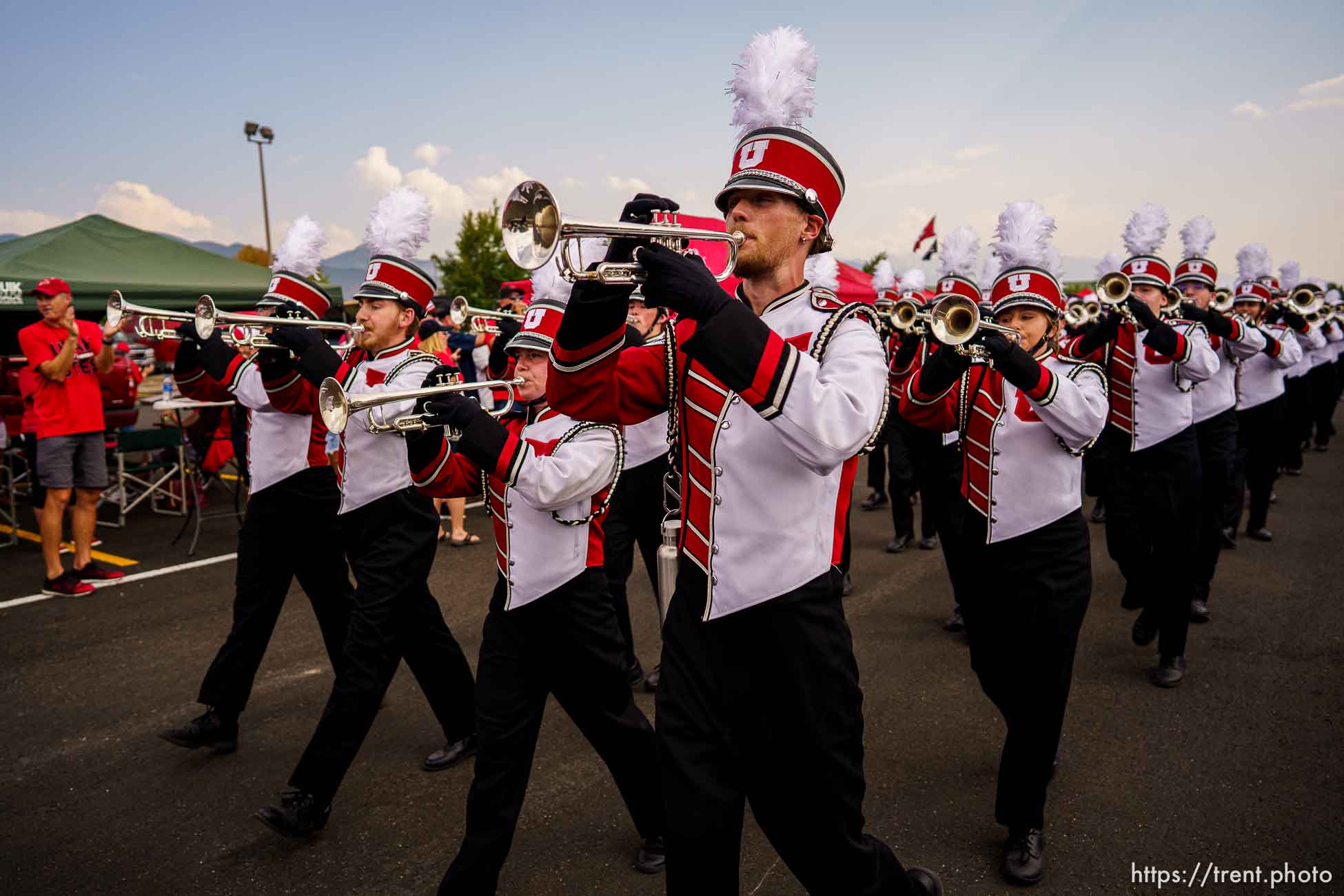 (Trent Nelson  |  The Salt Lake Tribune) The University of Utah Marching Band marches through the tailgate zone as the Utah Utes host the Weber State Wildcats in Salt Lake City on Thursday, Sept. 2, 2021.