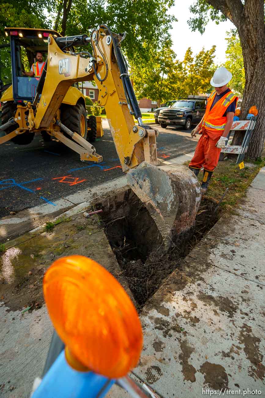 (Trent Nelson  |  The Salt Lake Tribune) Lorenzo Terzo and Dustin Whitaker at work as a leaking water connection is replaced by a public utilities crew in Salt Lake City on Thursday, Sept. 9, 2021.