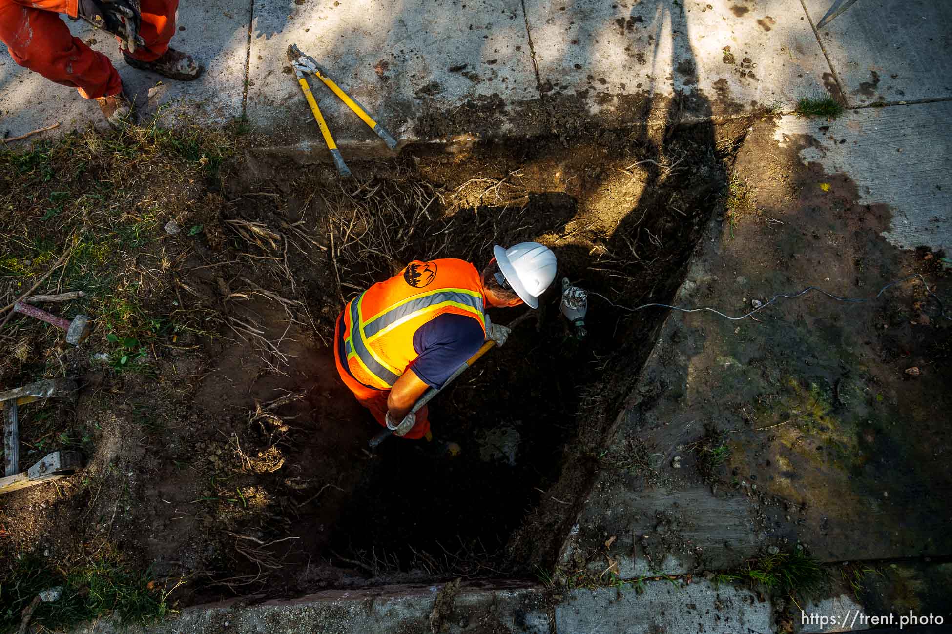 (Trent Nelson  |  The Salt Lake Tribune) Dustin Whitaker at work as a leaking water connection is replaced by a public utilities crew in Salt Lake City on Thursday, Sept. 9, 2021.