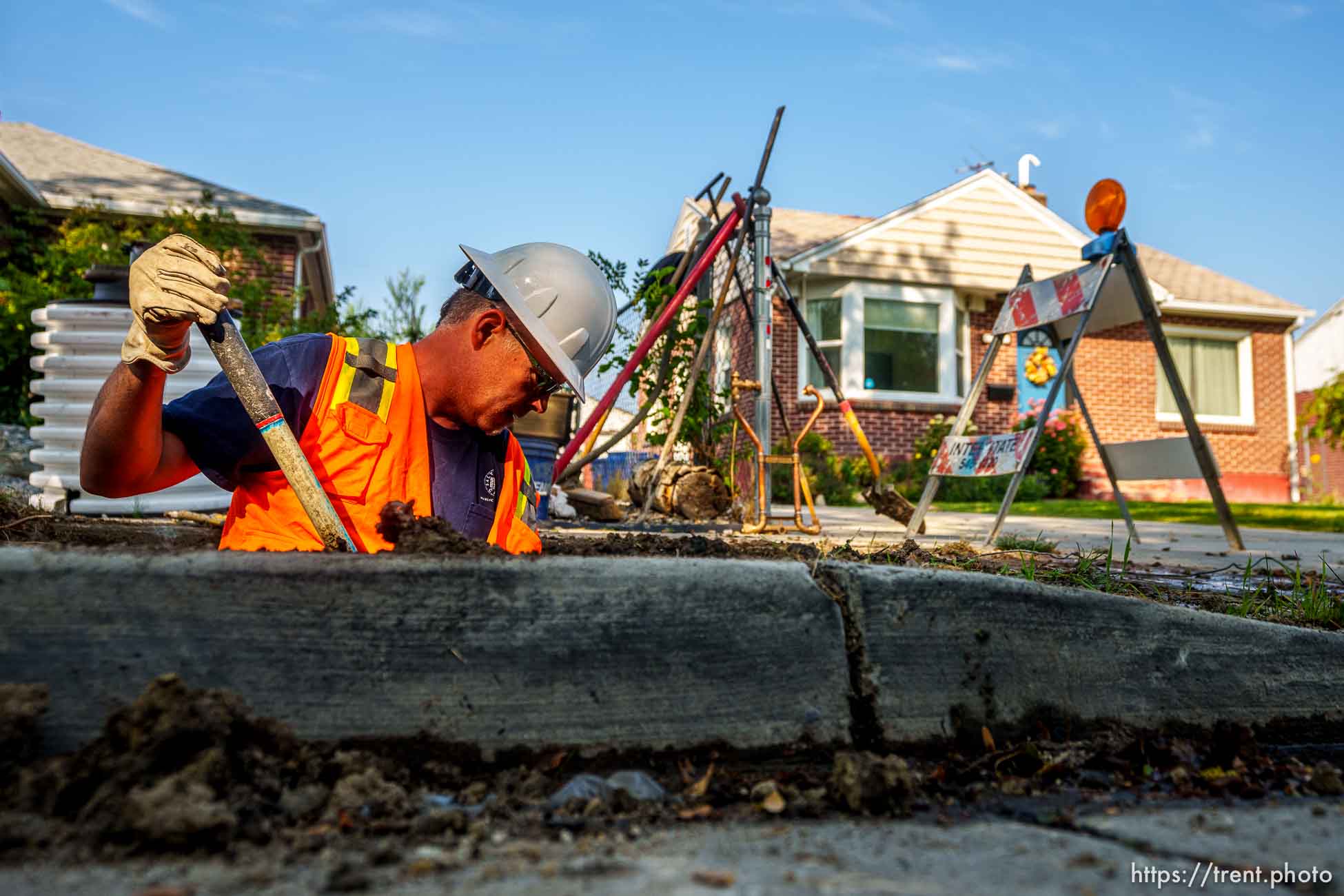 (Trent Nelson  |  The Salt Lake Tribune) Dustin Whitaker at work as a leaking water connection is replaced by a public utilities crew in Salt Lake City on Thursday, Sept. 9, 2021.