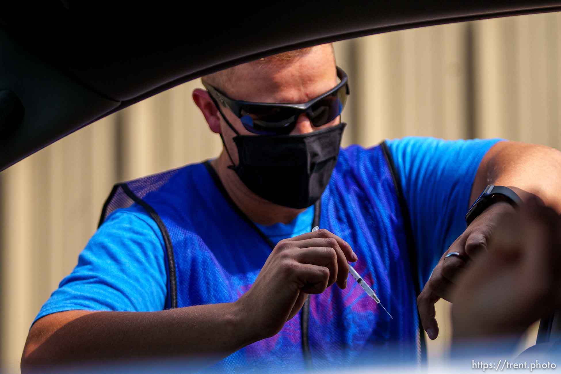 (Trent Nelson  |  The Salt Lake Tribune) Bryce Combe administers a dose of the Pfizer COVID-19 vaccine at a drive-thru event organized by the Utah County Health Department in Spanish Fork on Friday, Sept. 10, 2021.