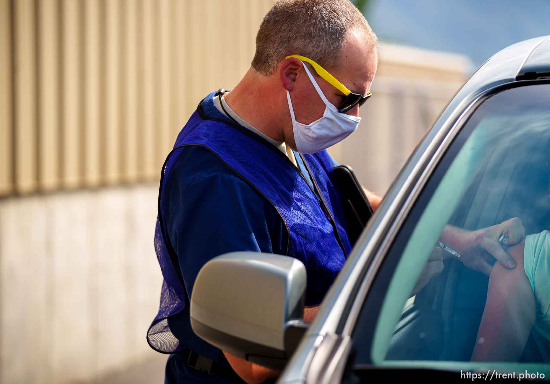 (Trent Nelson  |  The Salt Lake Tribune) Ryan Reneer administers a dose of the Pfizer COVID-19 vaccine at a drive-thru event organized by the Utah County Health Department in Spanish Fork on Friday, Sept. 10, 2021.