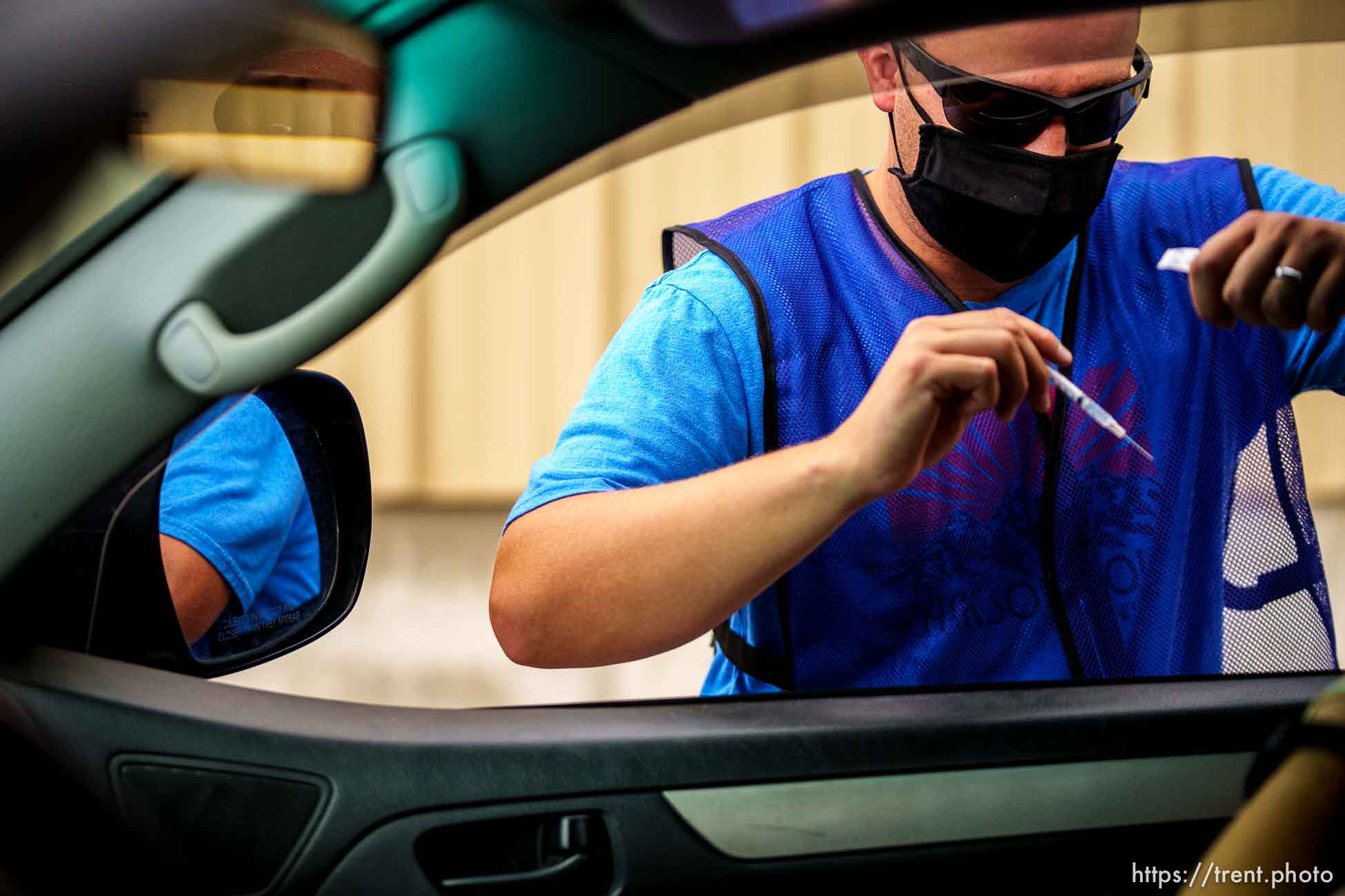 (Trent Nelson  |  The Salt Lake Tribune) Bryce Combe administers a dose of the Pfizer COVID-19 vaccine at a drive-thru event organized by the Utah County Health Department in Spanish Fork on Friday, Sept. 10, 2021.